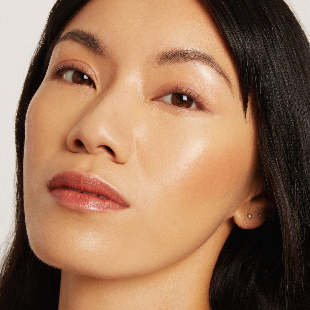 Close-up of a woman's face with a neutral background