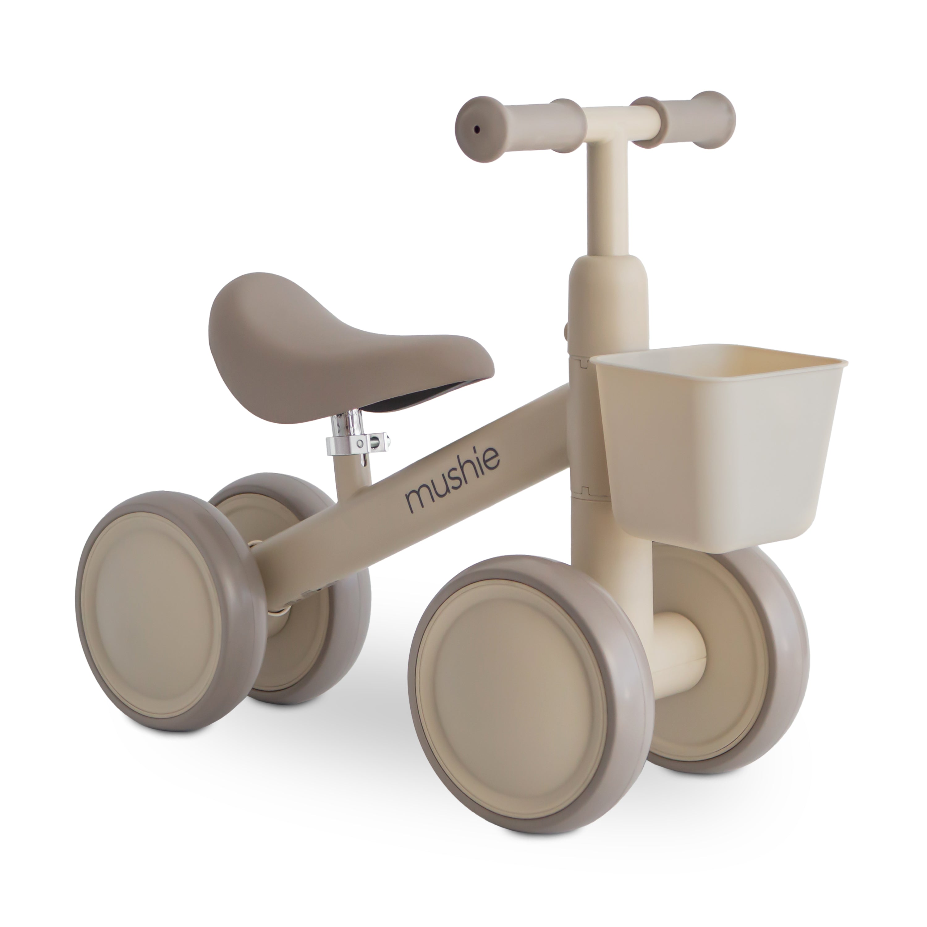 Beige balance bike with a basket on a white background