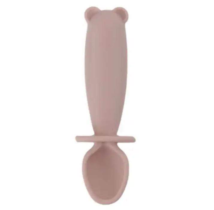 Pink bear-shaped spoon on a white background