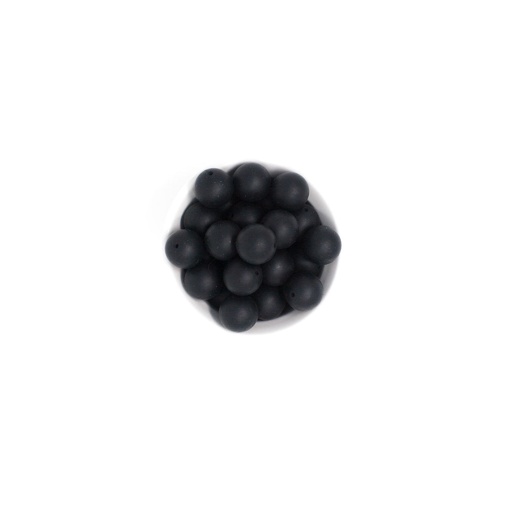 Black spherical object on a white background