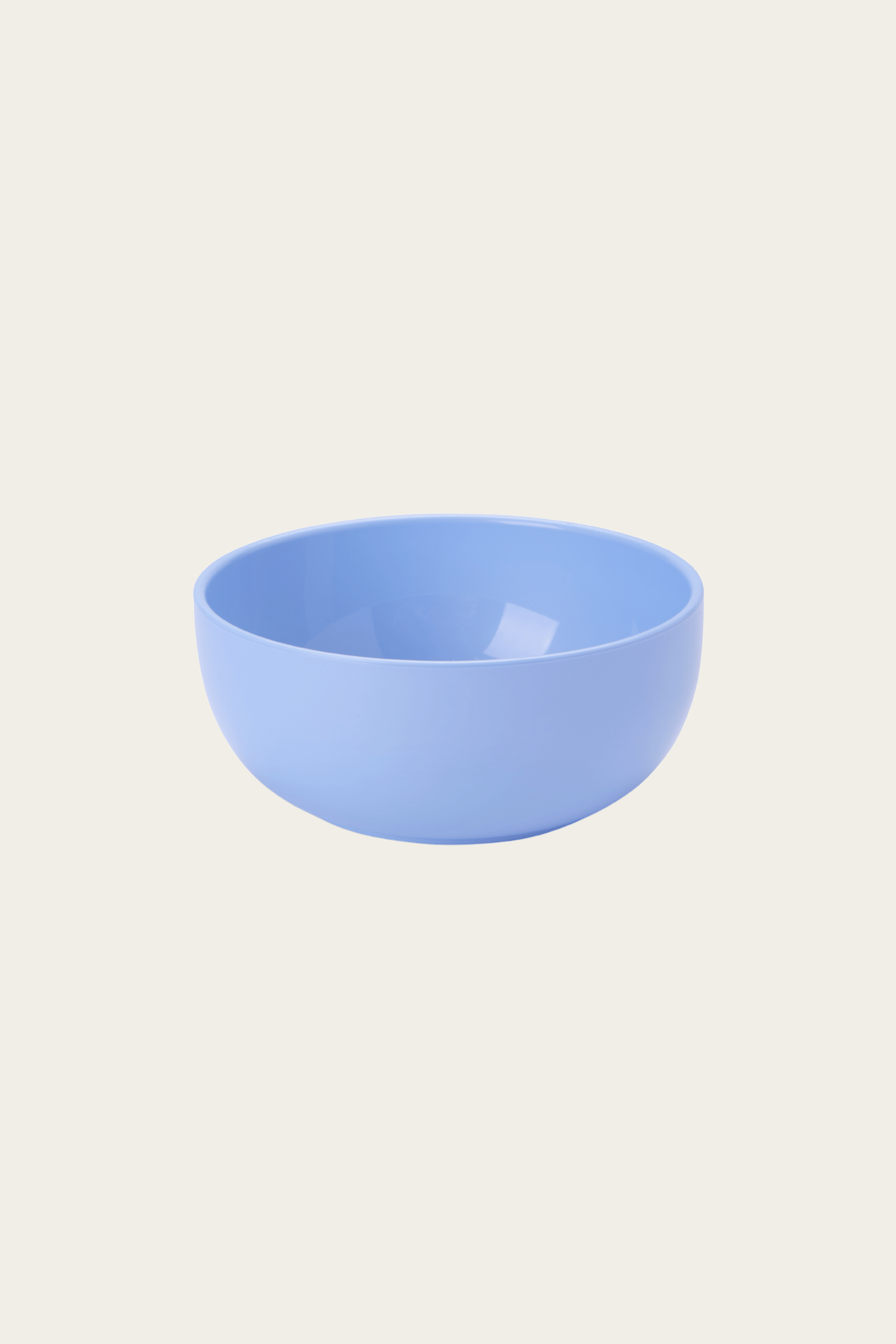 Blue ceramic bowl on a light beige background