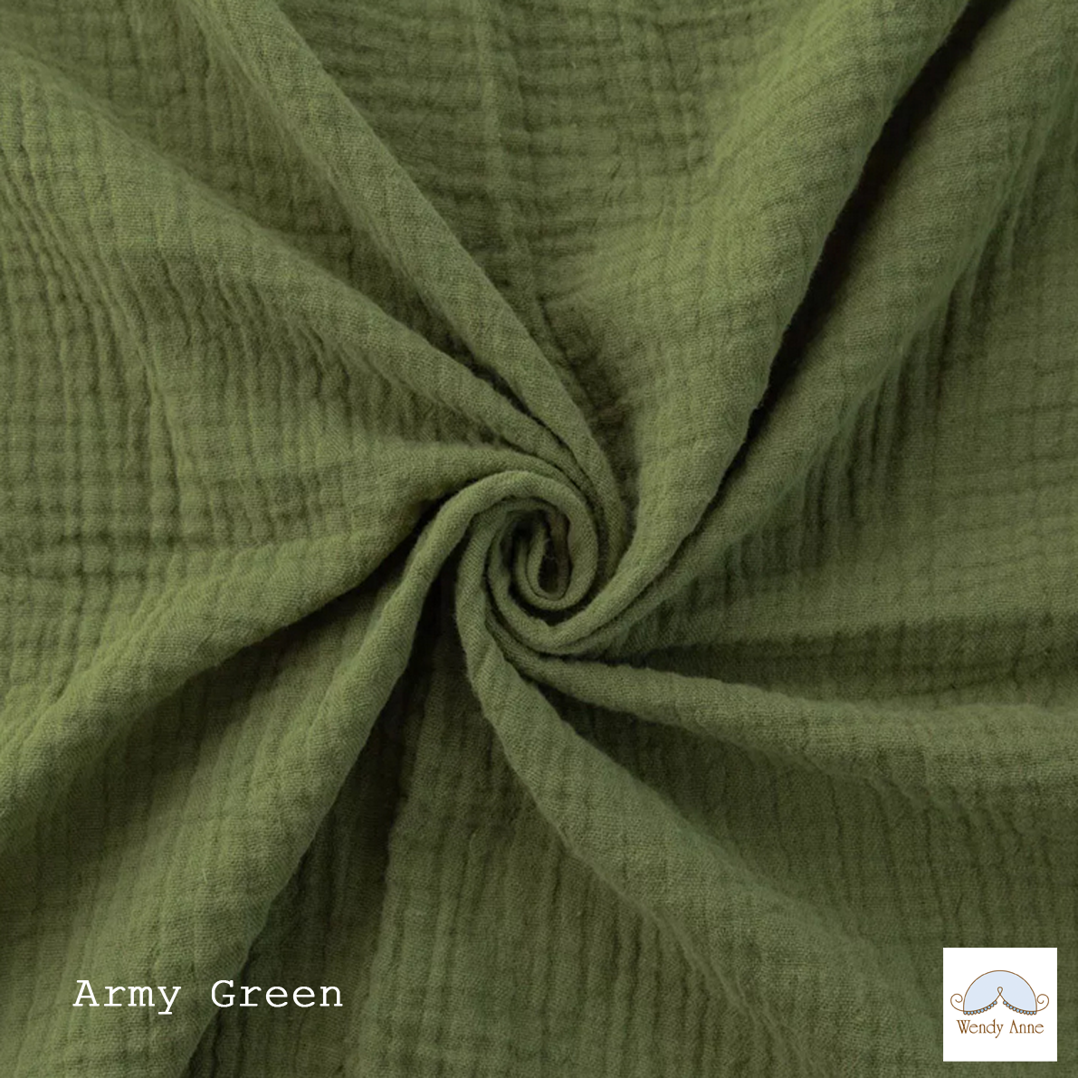 Close-up of olive green fabric with a visible brand logo in the corner.