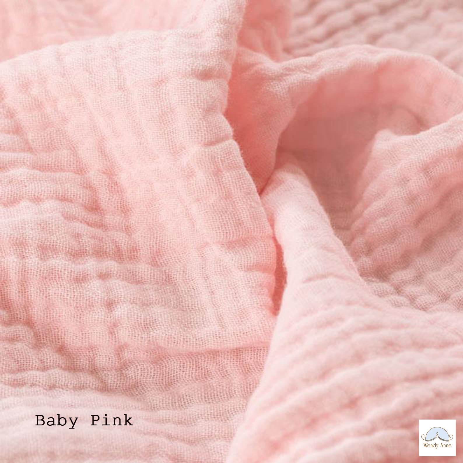 Close-up of baby pink fabric with 'Baby Pink' text and a brand logo.