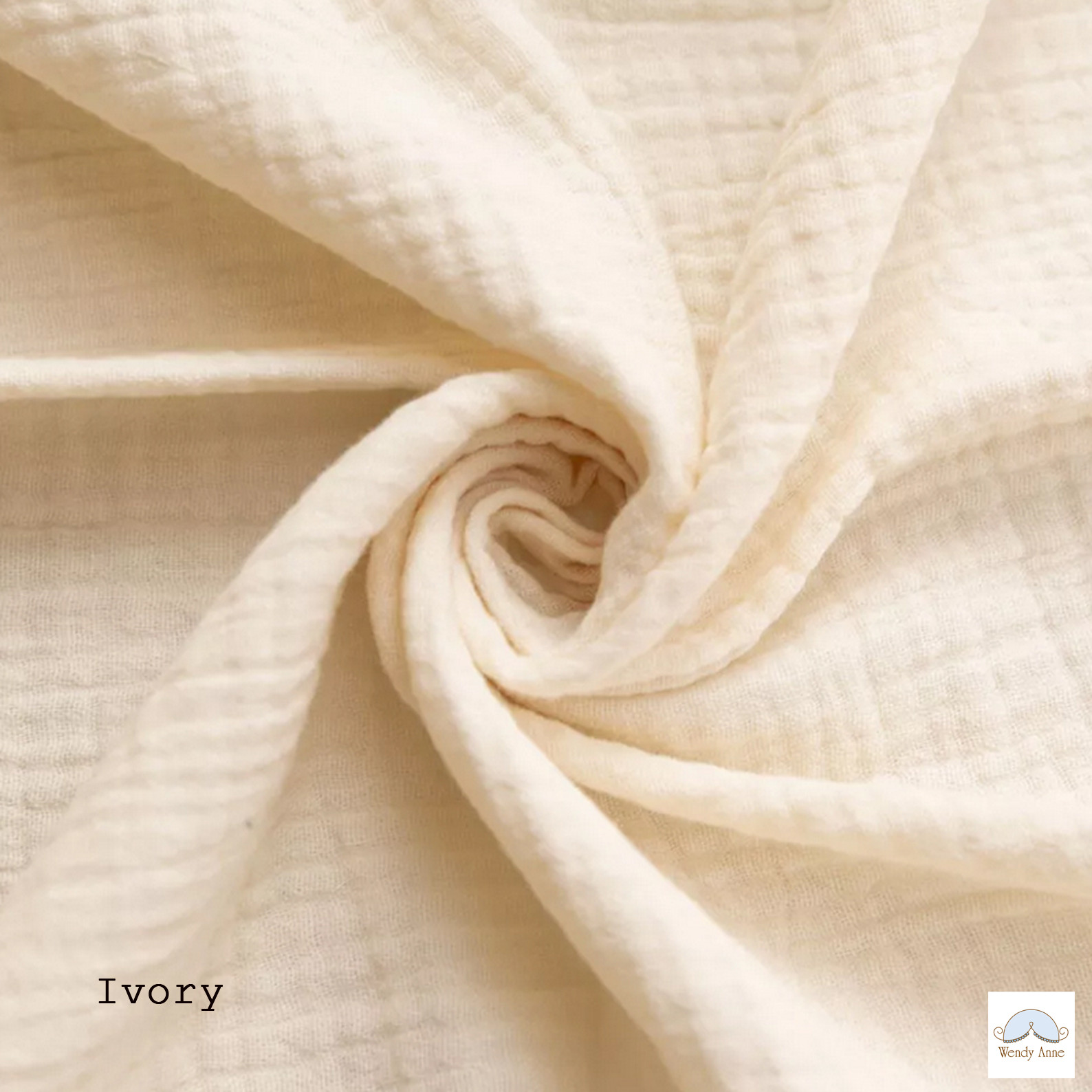 Close-up of beige fabric with a swirl pattern, labeled 'Ivory'.