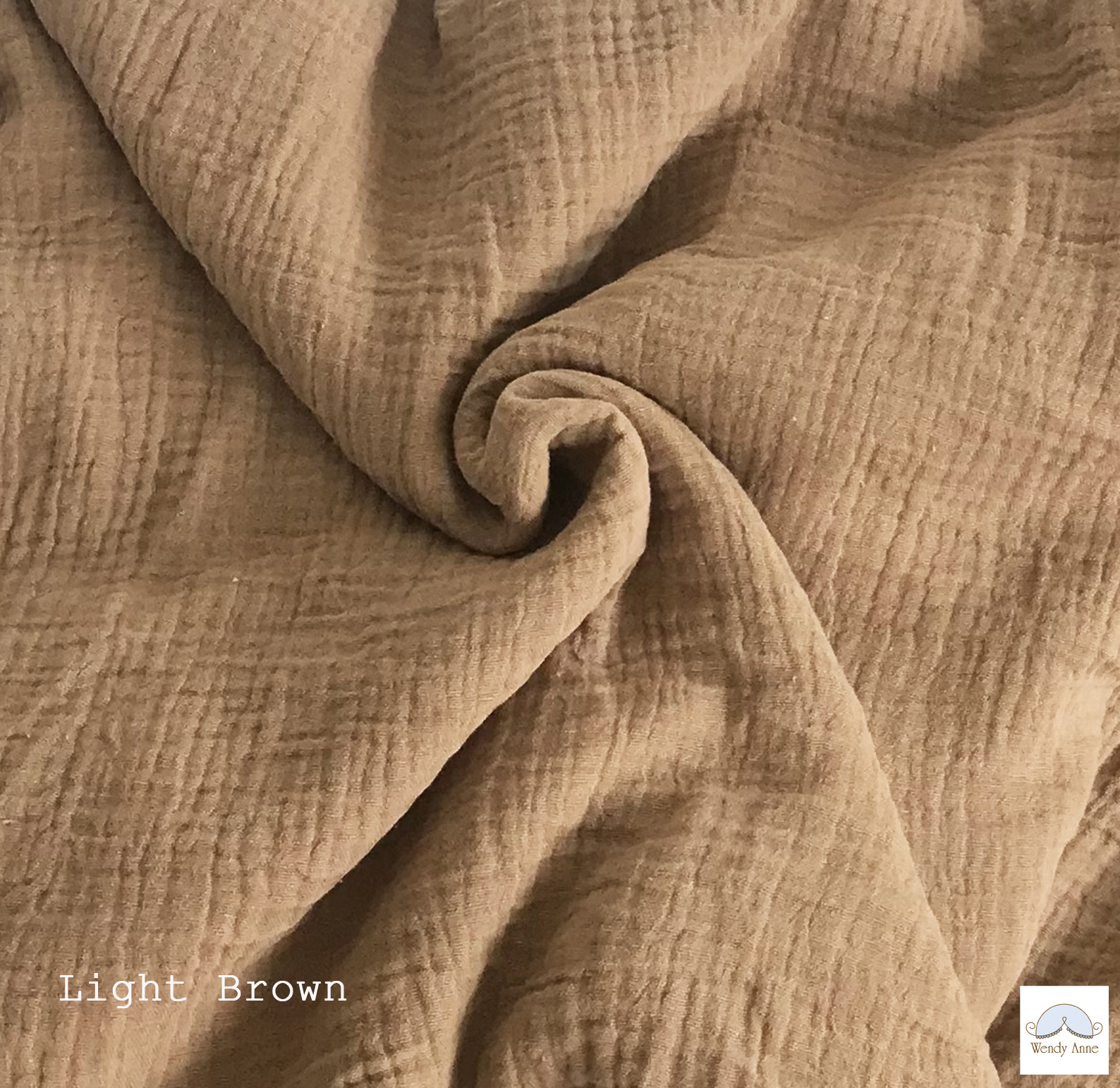 Close-up of light brown fabric with a textured pattern
