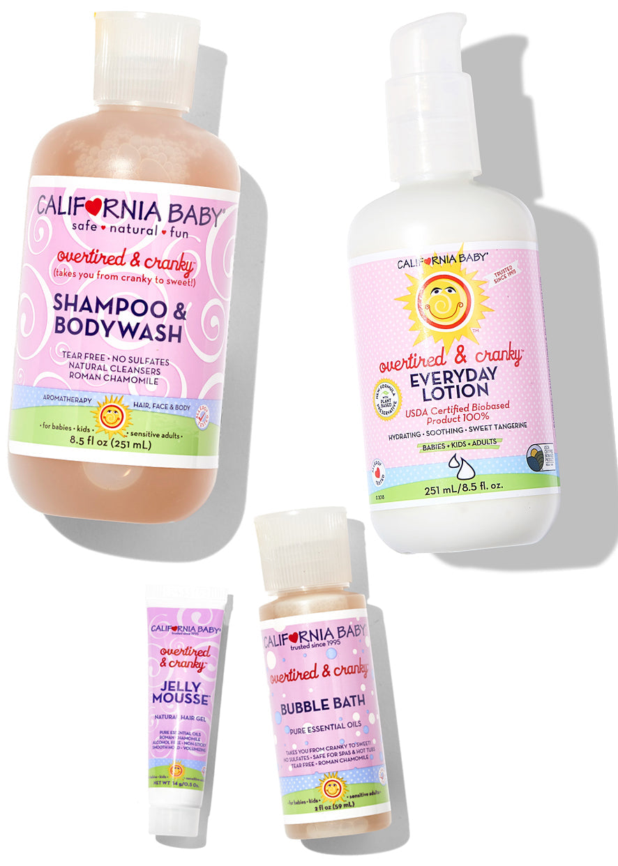 California Baby product set including shampoo & bodywash, lotion, jelly mousse, and bubble bath on a white background.