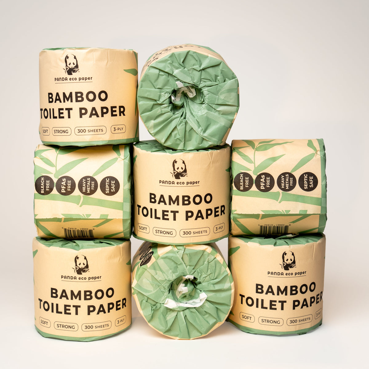 Stack of bamboo toilet paper rolls with packaging on a white background