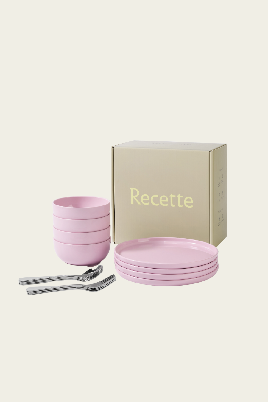 Set of pink ceramic bowls and a box labeled 'Recette' on a beige background