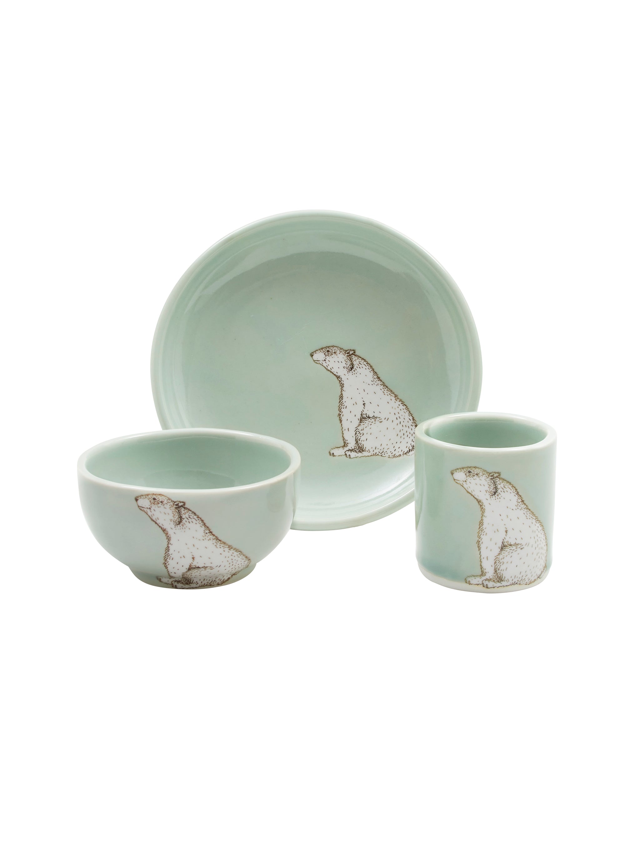 Ceramic tableware set with bear design on a white background