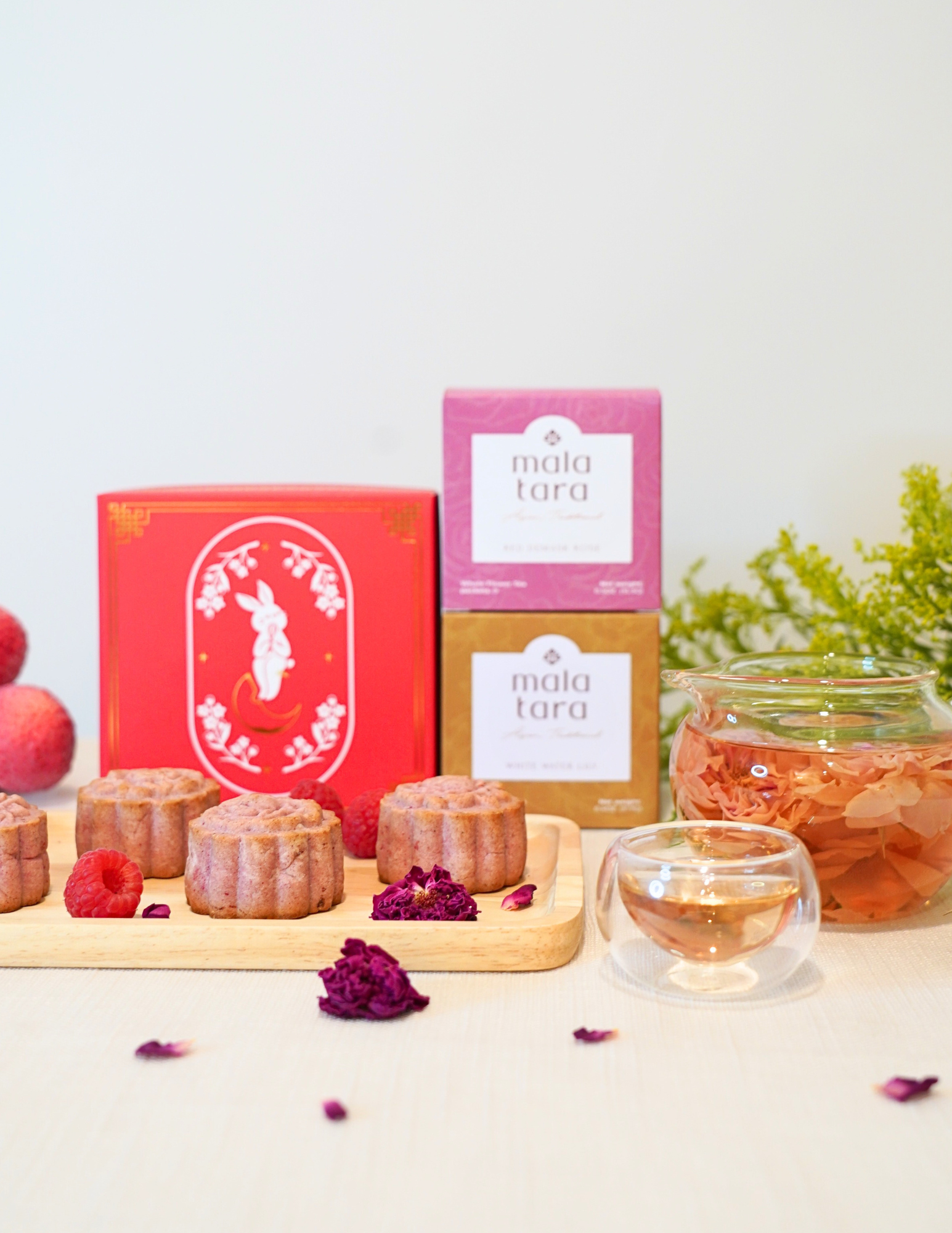 Tea packaging with a glass of tea and tea bags on a light background