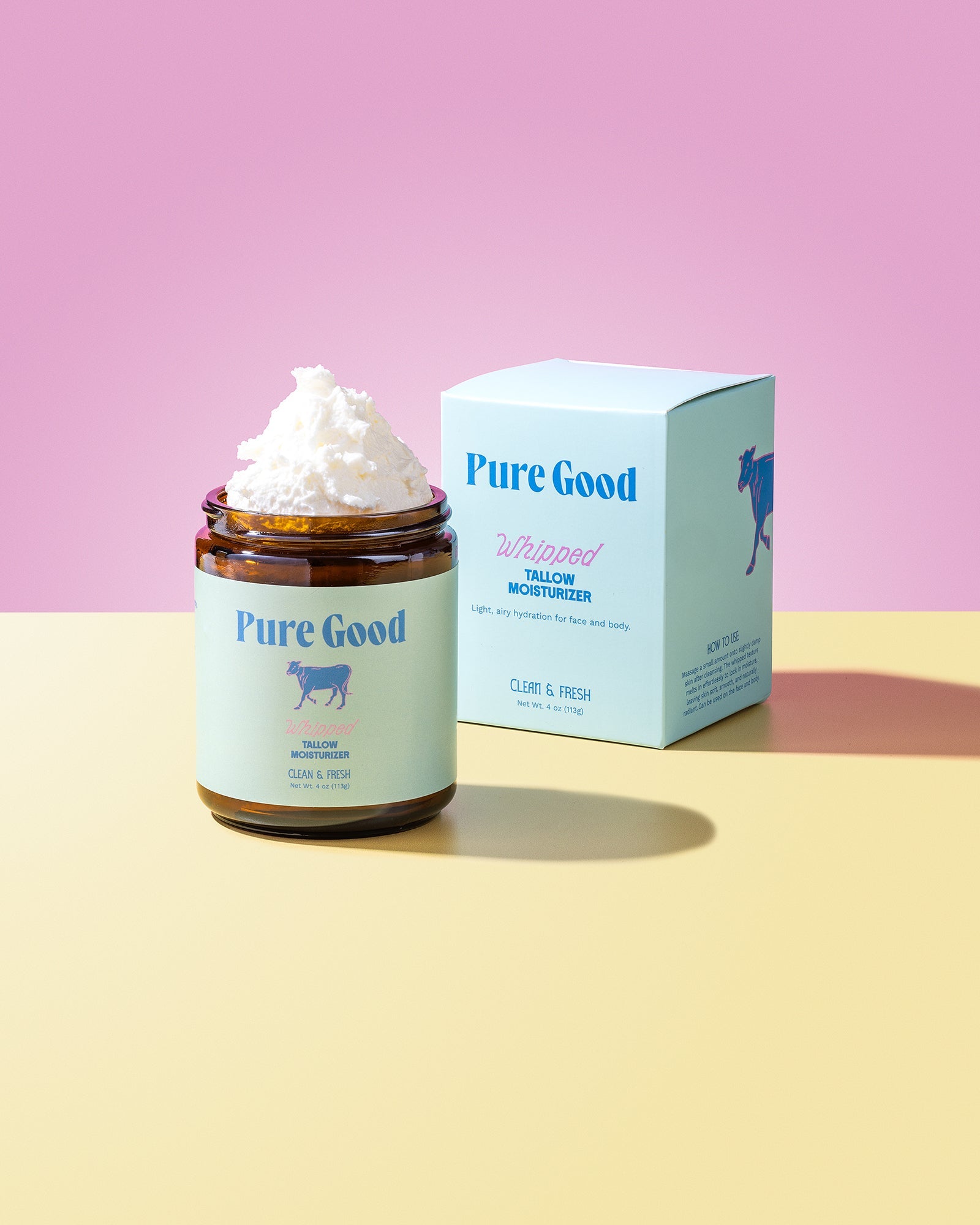 Jar of whipped cream with 'Pure Good' branding on a pink and yellow gradient background
