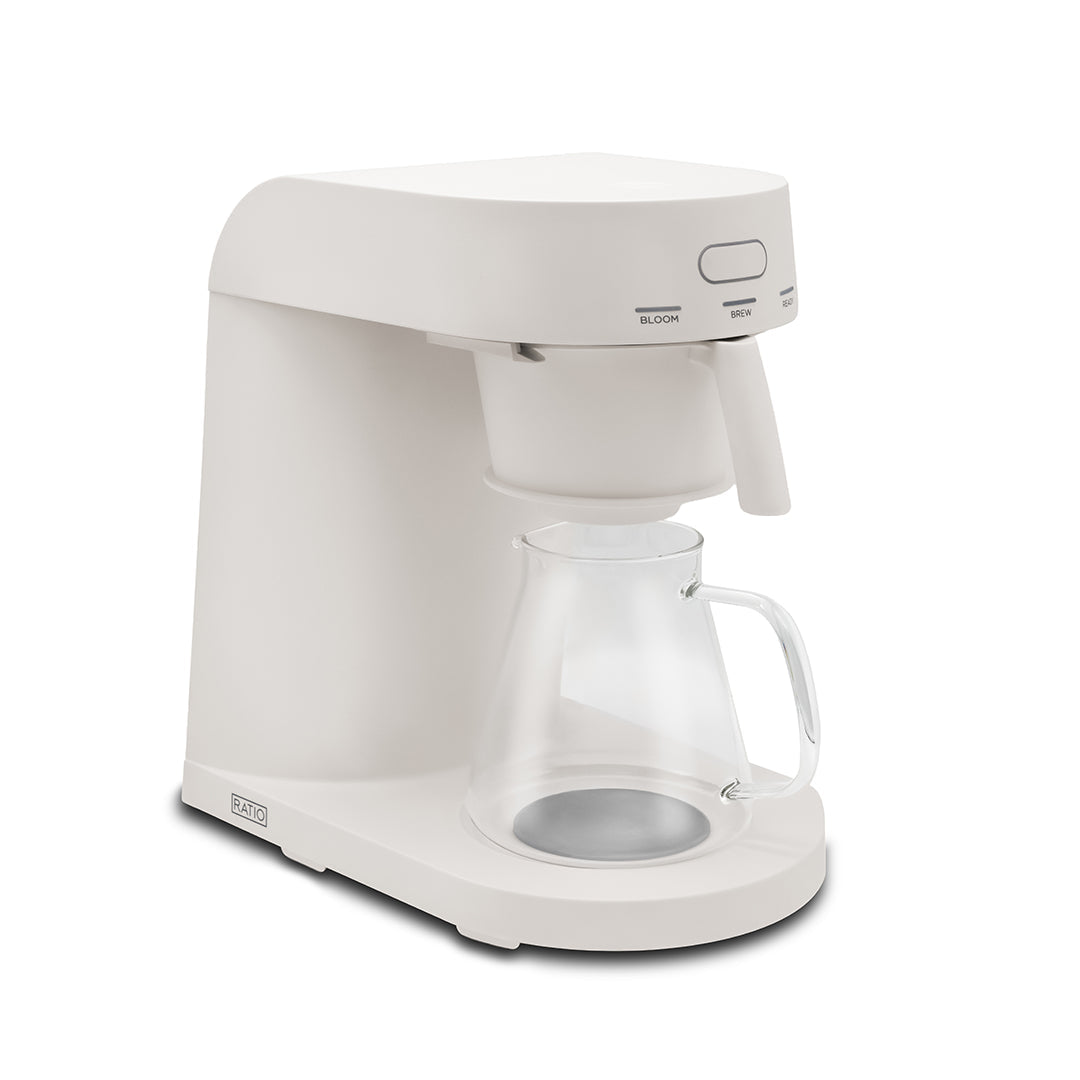 White coffee maker with clear carafe on a white background