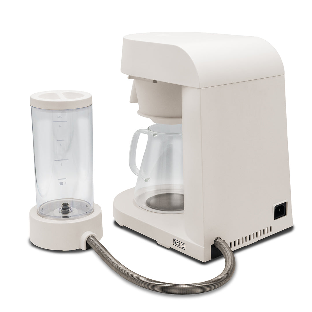 White coffee maker with glass carafe on a white background
