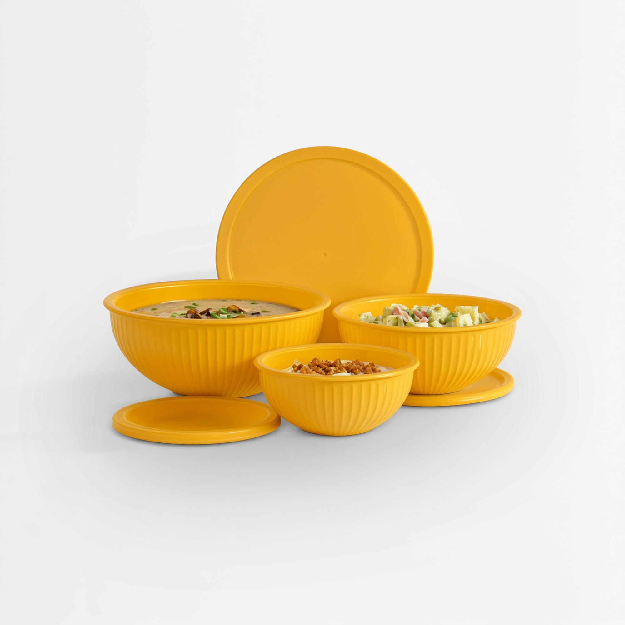 Set of yellow bowls with lids on a white background