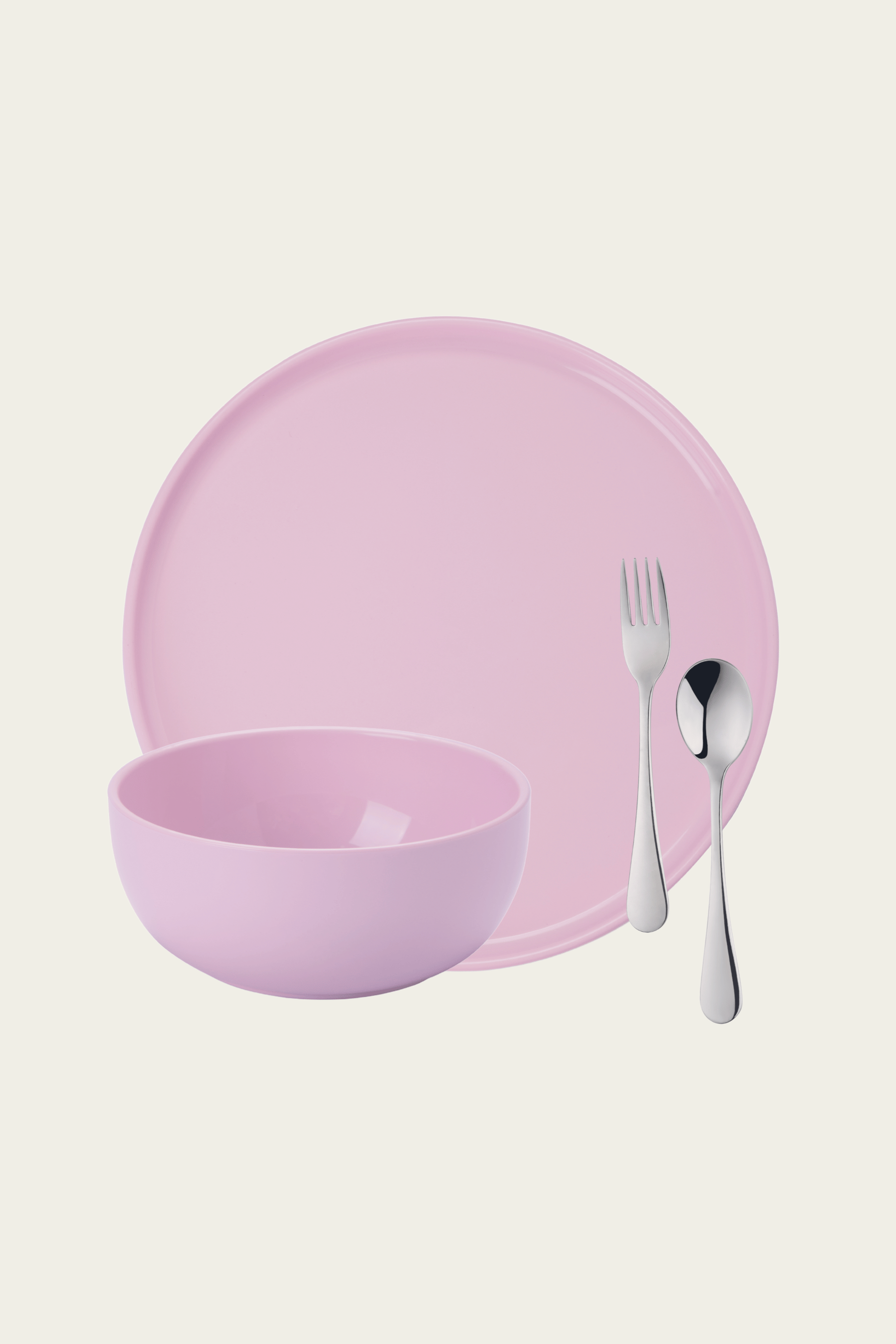 Pink ceramic plate, bowl, fork, and spoon on a light pink background