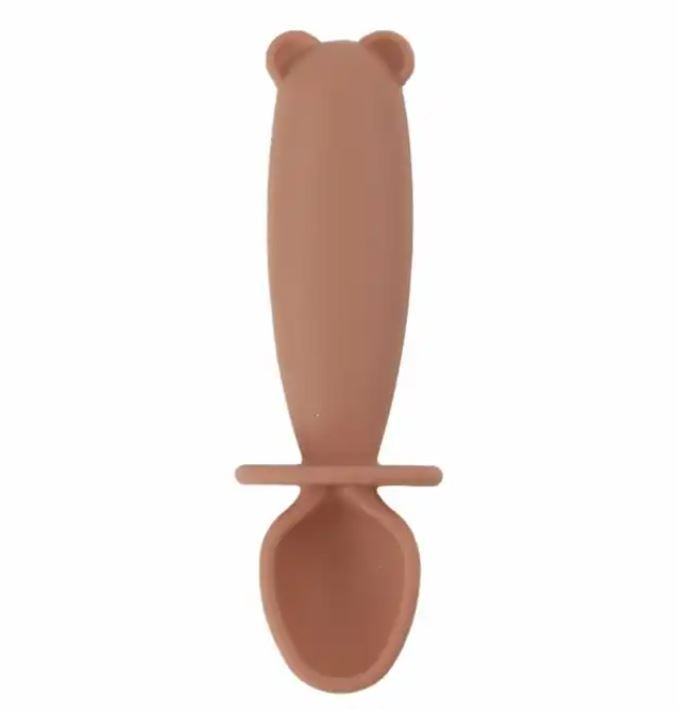 Brown silicone spoon with bear-shaped handle on a white background