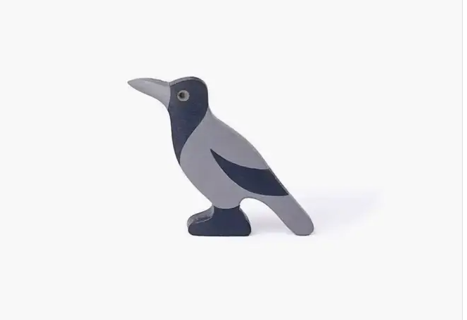 Wooden bird figurine on a white background