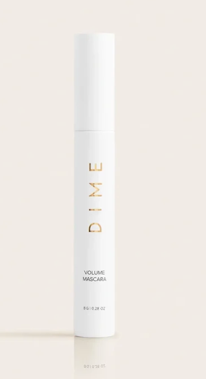 Dime Volume Mascara with black brush and white tube on a white background