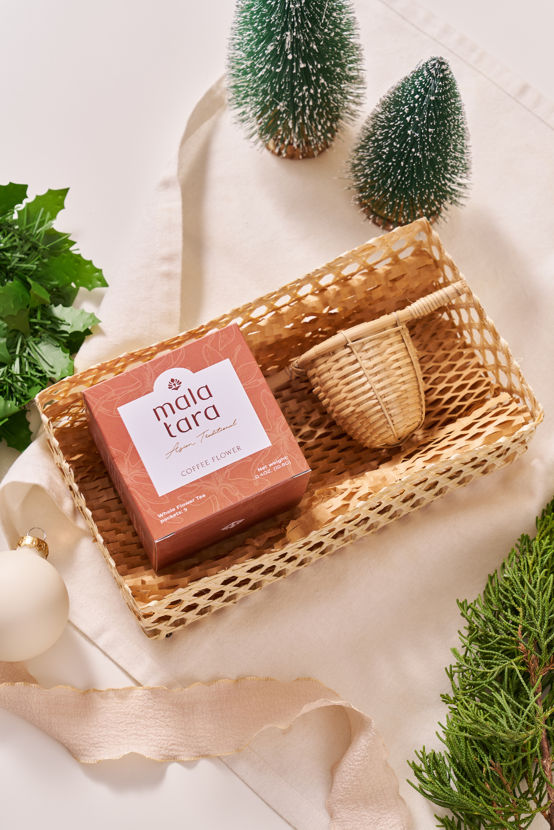Mola Tora soap bar in a wicker basket with decorative elements on a light background