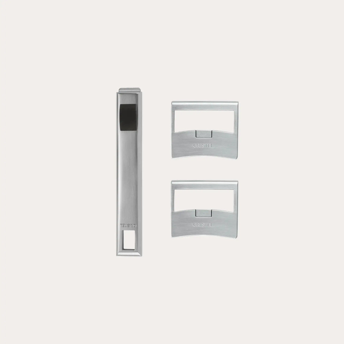 Set of three metallic door handles on a white background