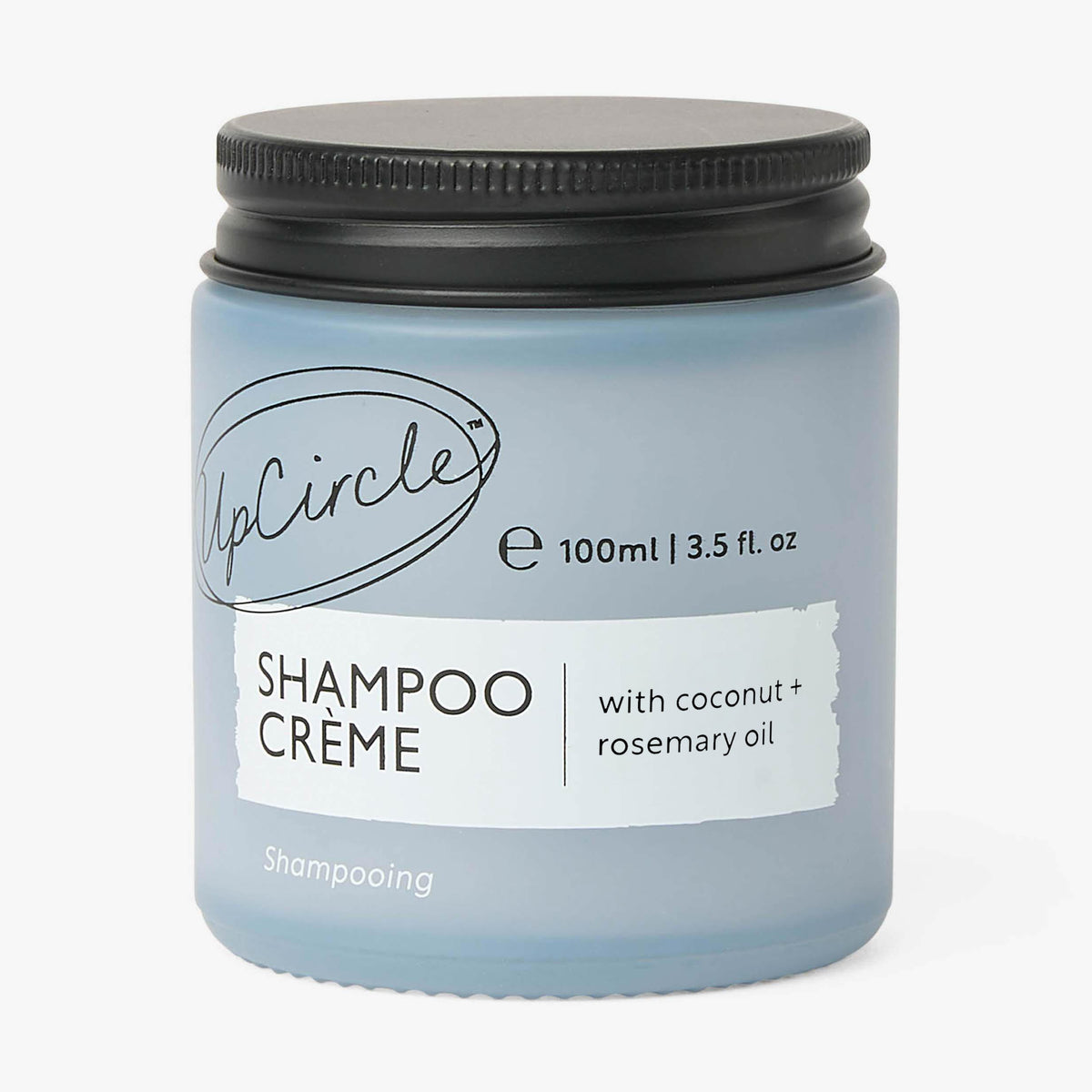Jar of Shampoo Crème with coconut and rosemary oil on a white background
