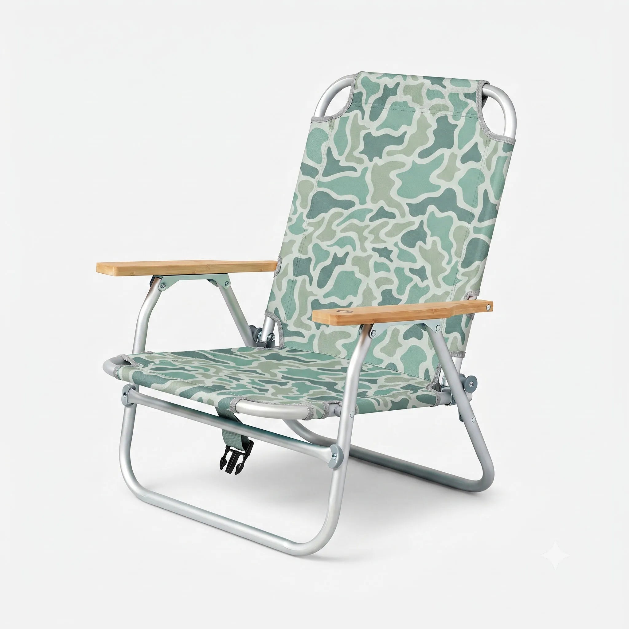 A folding outdoor lounge chair with a light green and white camouflage patterned fabric, a silver aluminum frame, and light wood armrests, shown on a light gray background.
