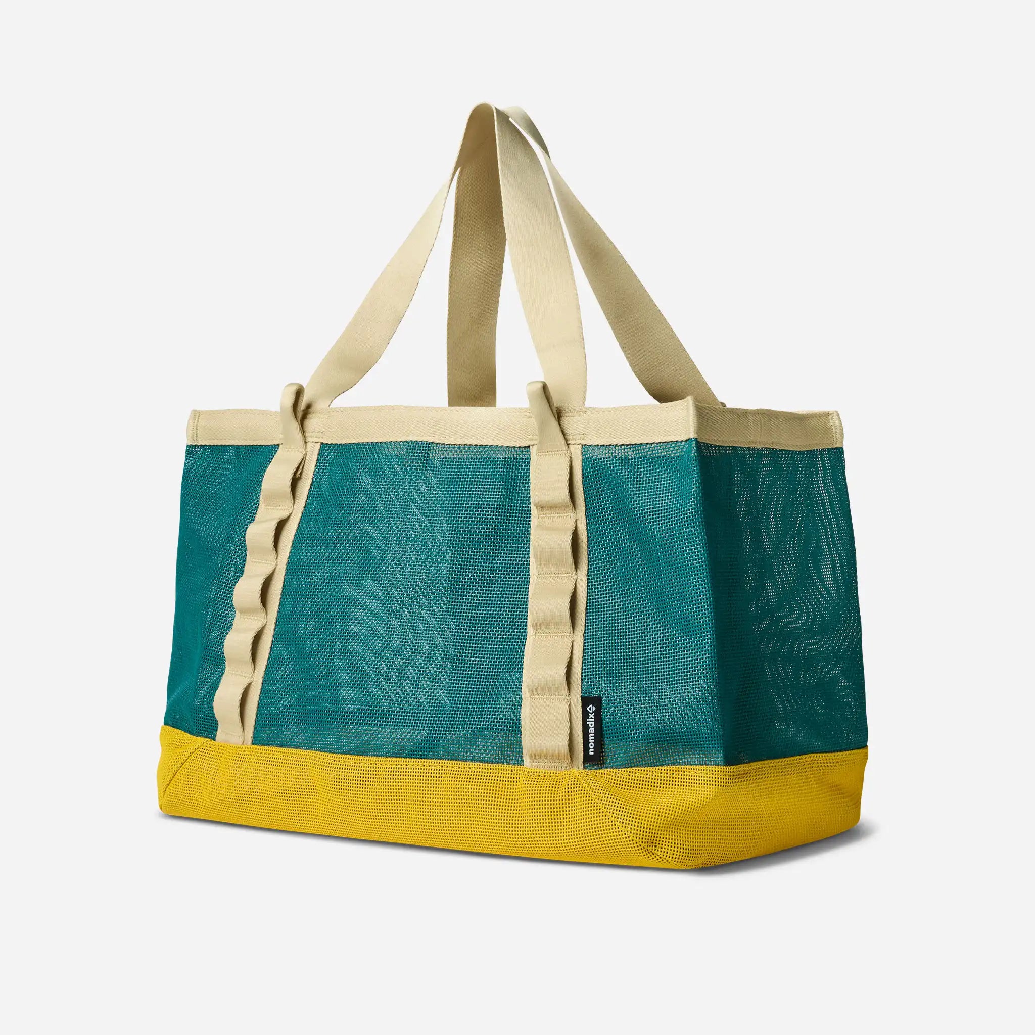 Tote bag with teal body and yellow base on a white background