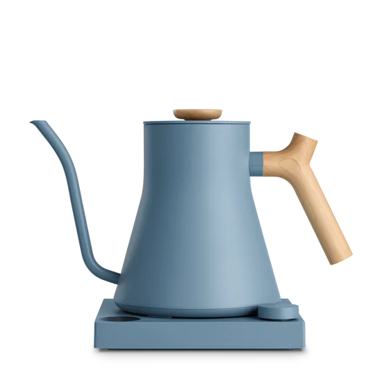 Blue kettle with wooden handle on a white background