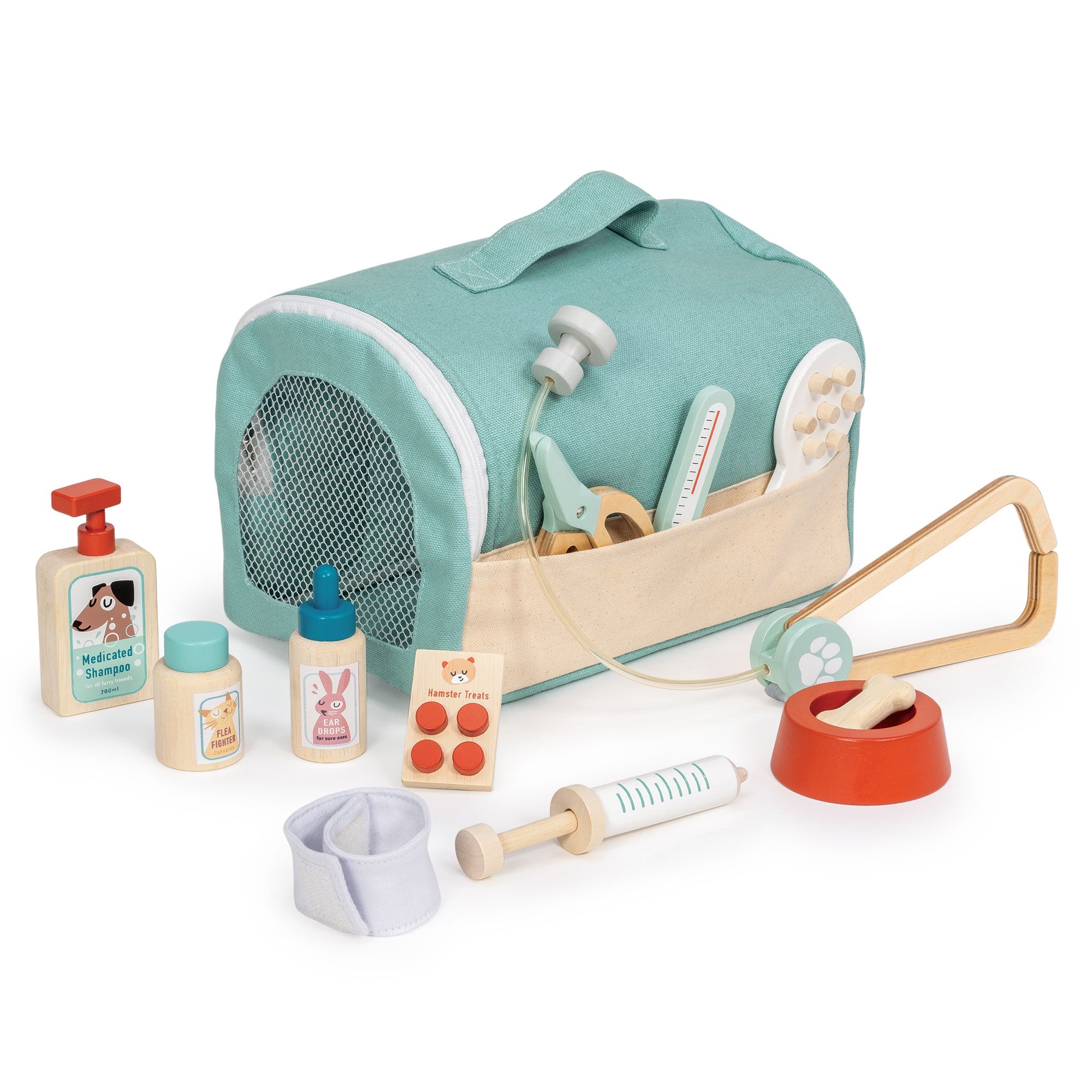 Pet grooming set with a teal bag, bottles, and tools on a white background