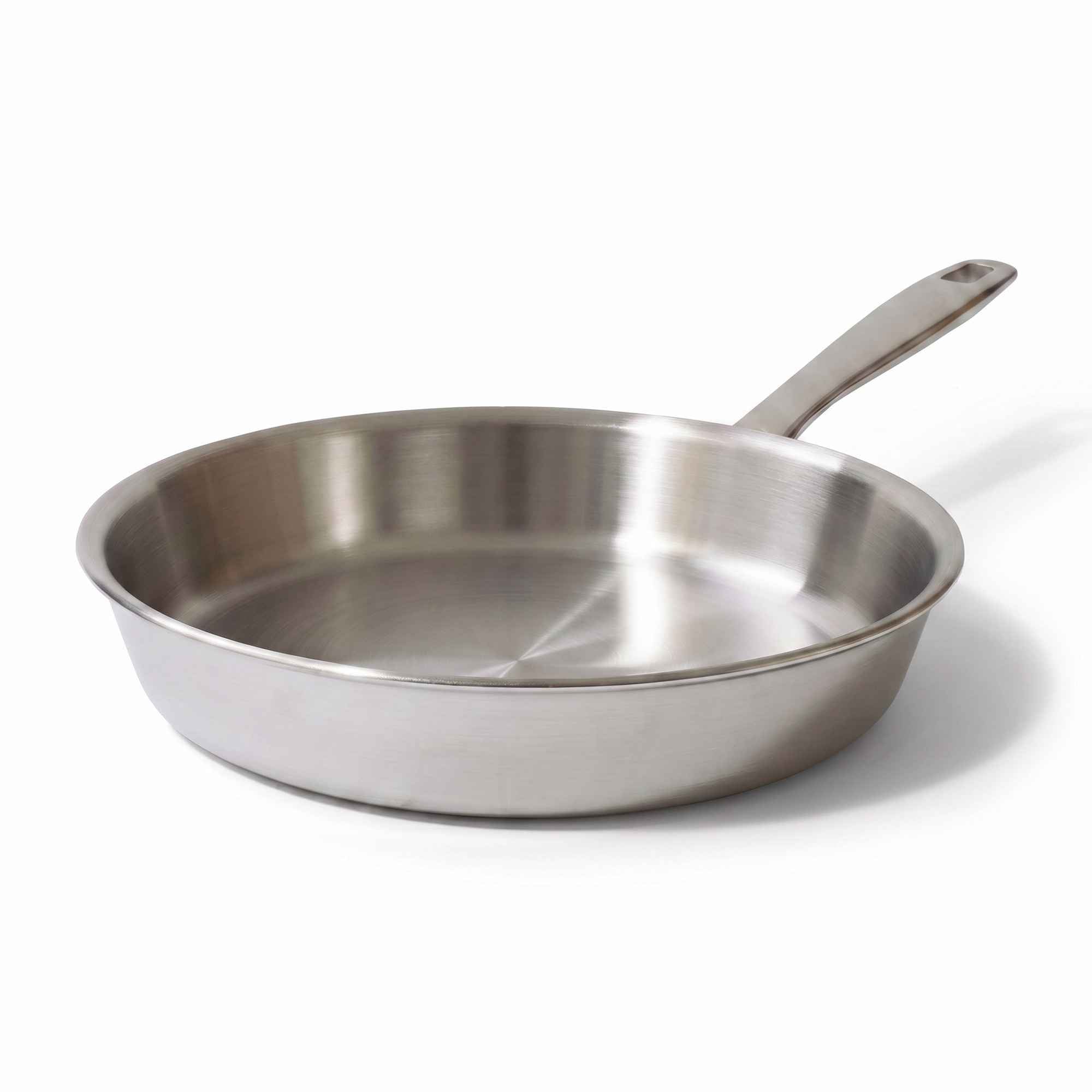 A stainless steel sauté pan with a long handle, shown from a three-quarter angle on a clean white background.