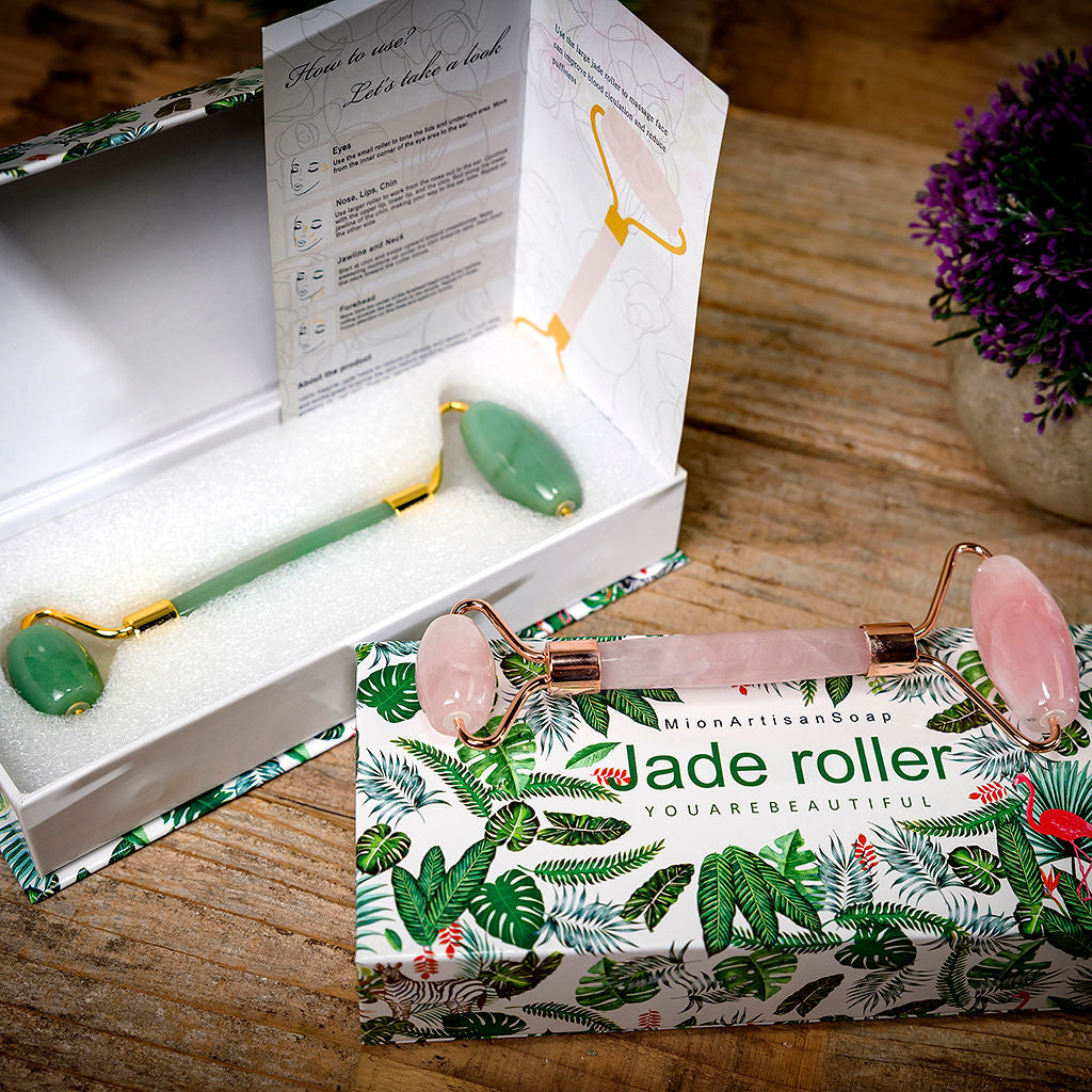 Jade roller set with packaging on a wooden surface