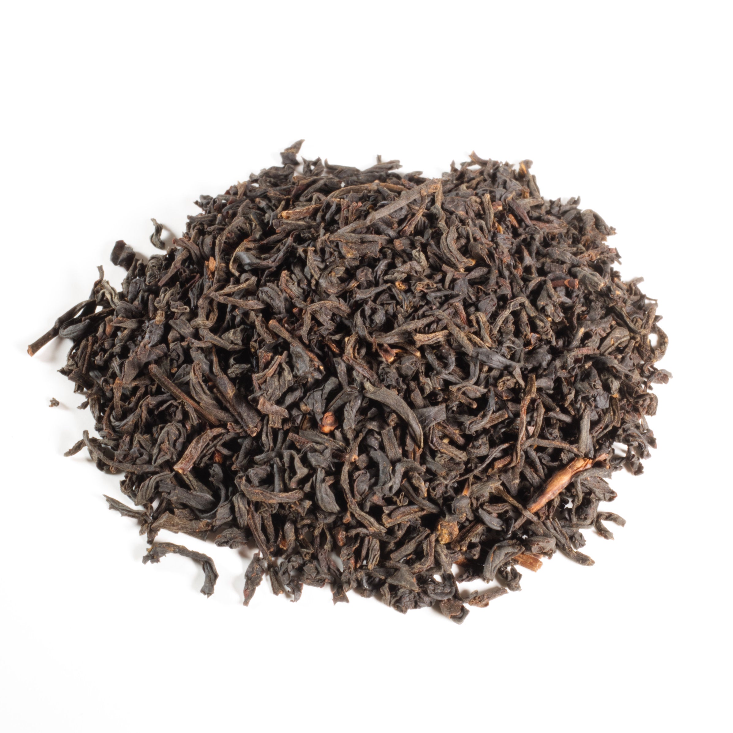 Dry black tea leaves on a white background