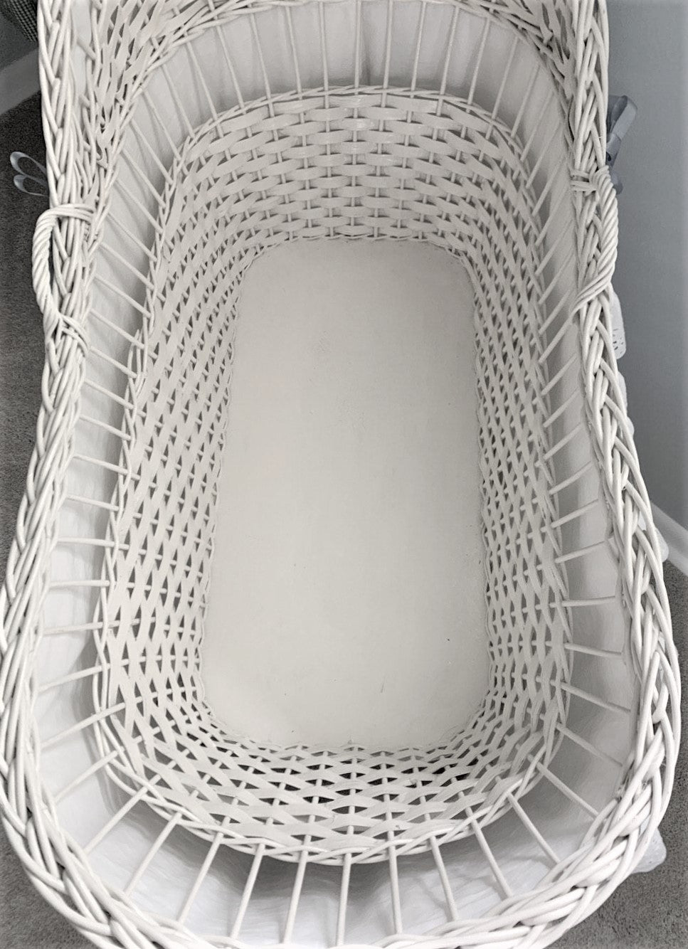 Close-up of a white woven basket with a blurred background
