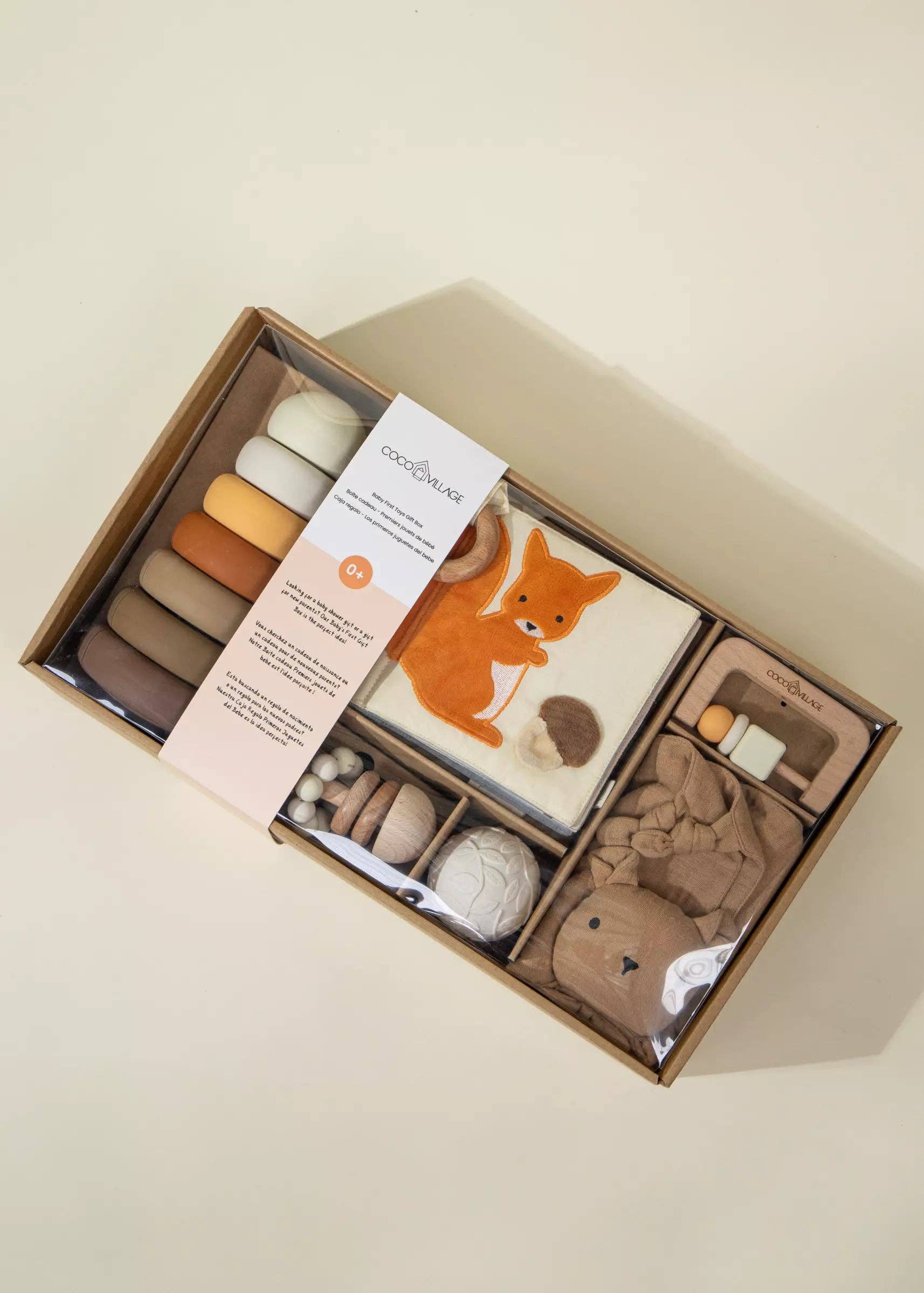 Baby product set with fox design in a box on a beige background