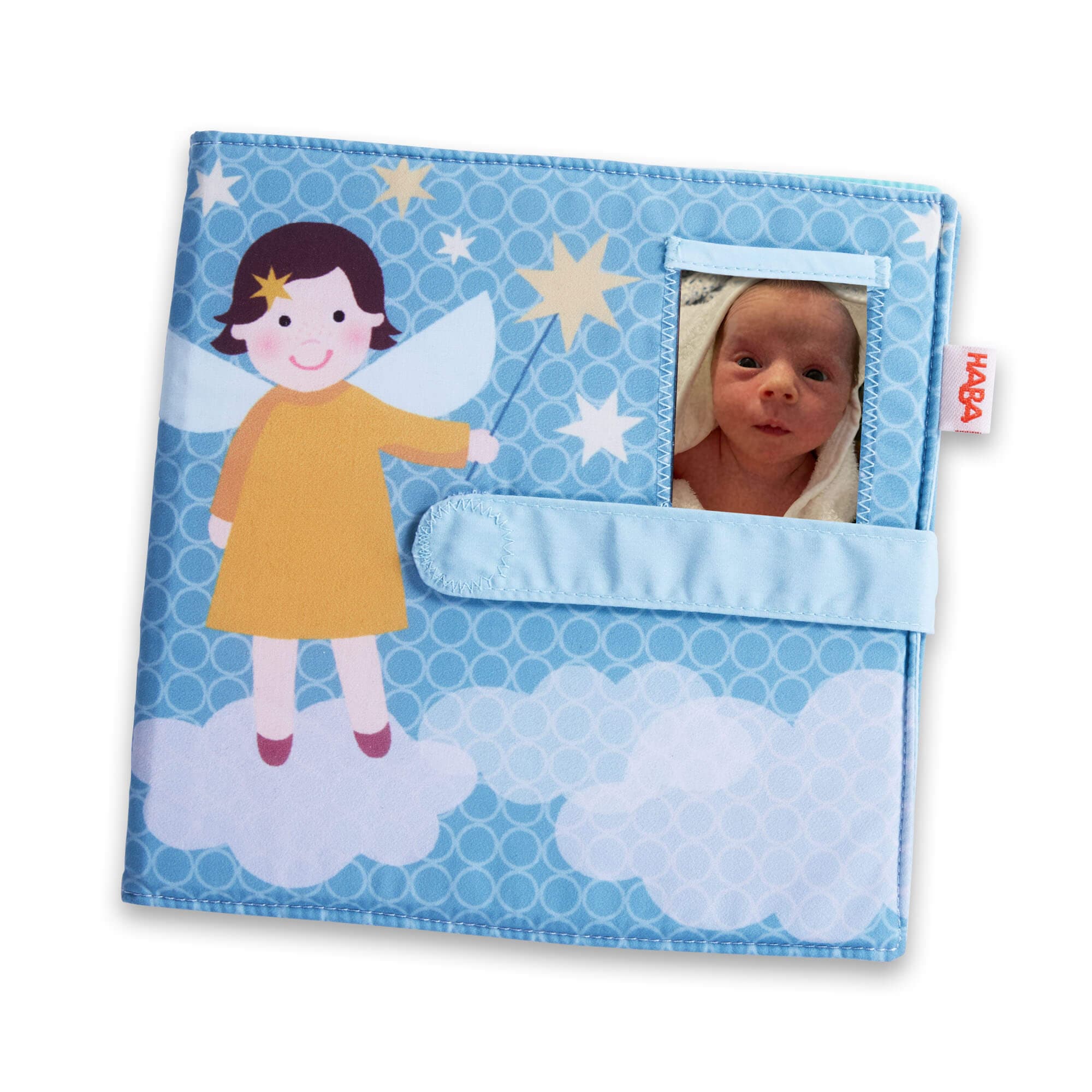 Baby book with fairy design and photo pocket on a blue background