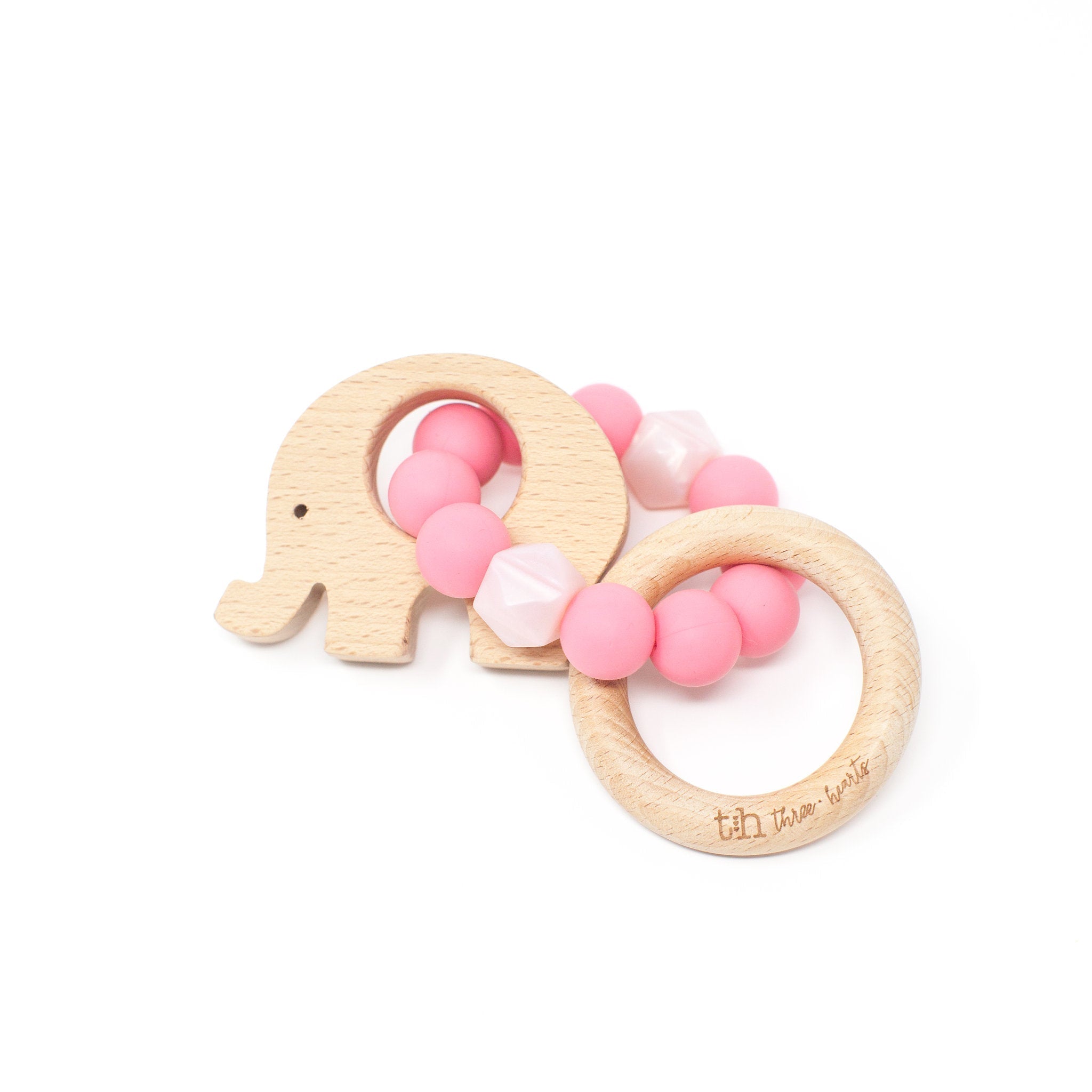 Wooden elephant-shaped teething ring with pink beads on a white background