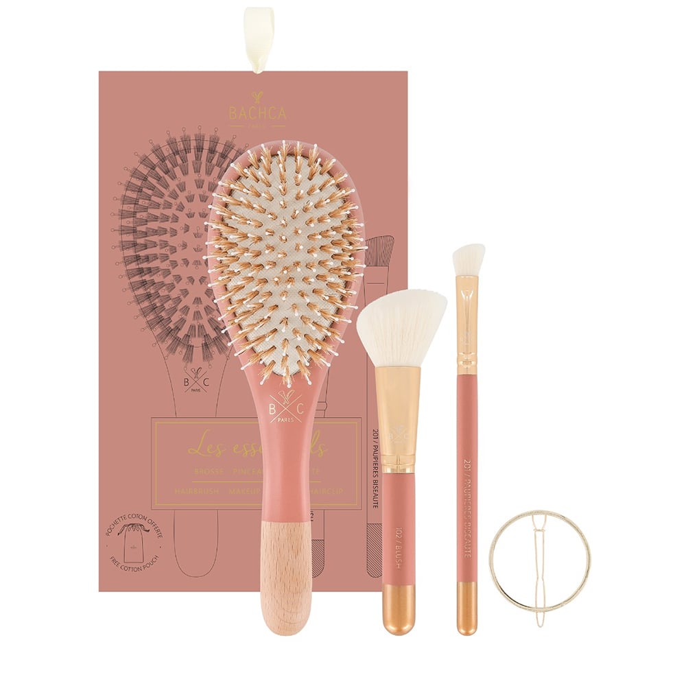 Makeup brush set with a pink and gold design on a white background