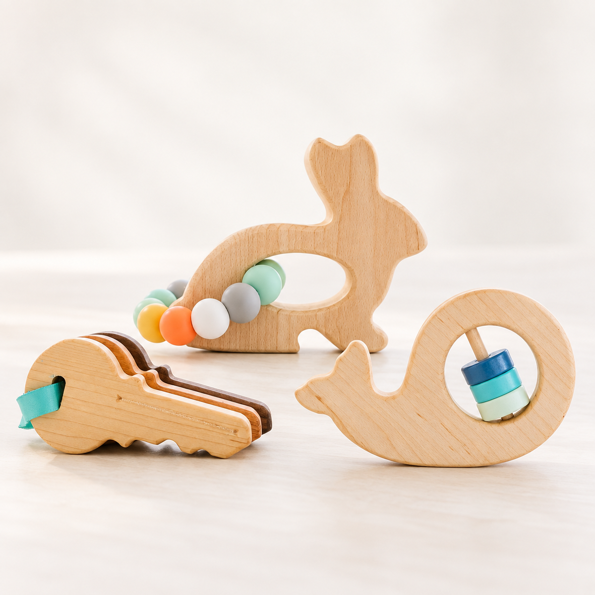 Bannor Toys Wooden Baby Gift Set with wooden toy keys, bunny grasping toy, and whale rattle