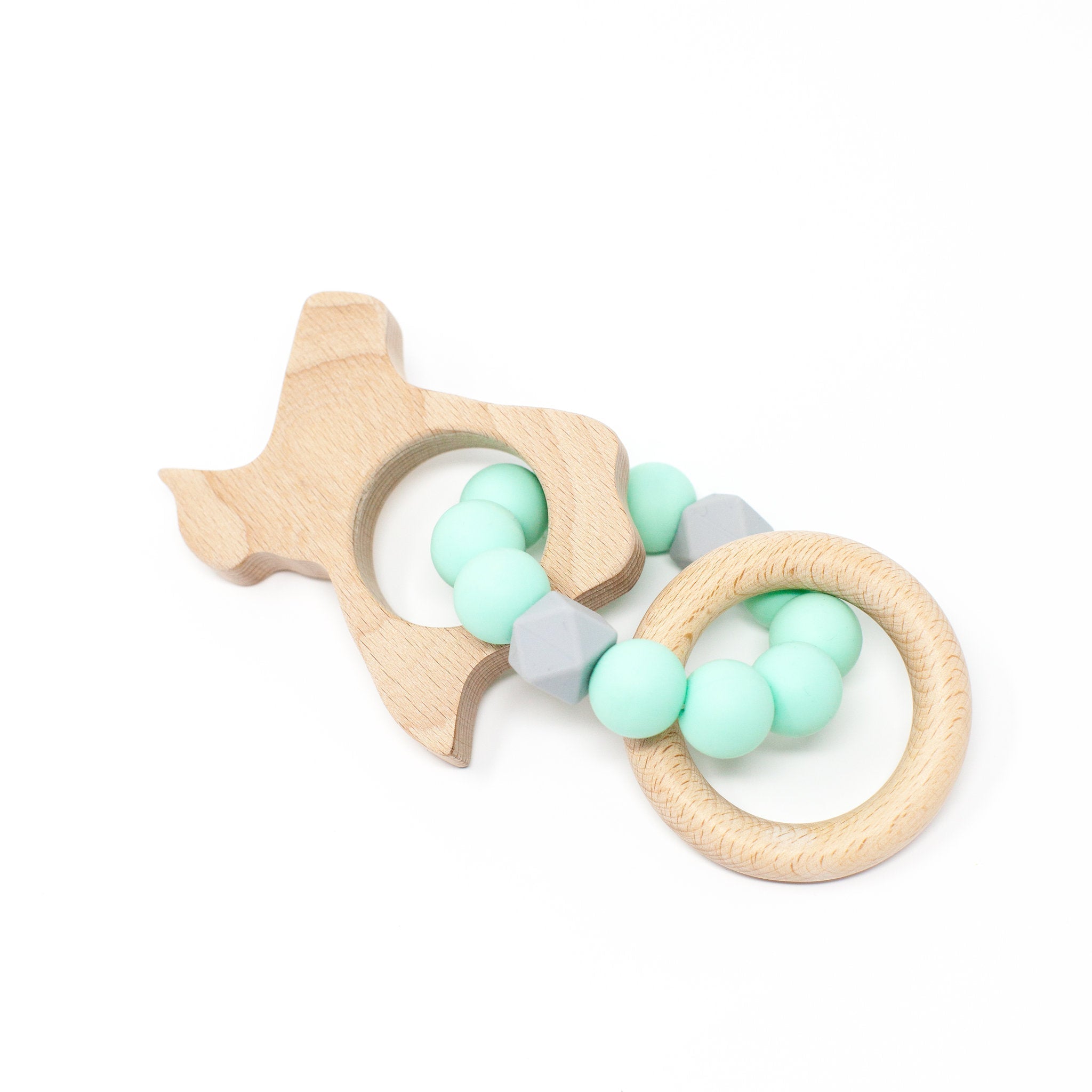 Wooden teething ring with mint green and gray beads on a white background