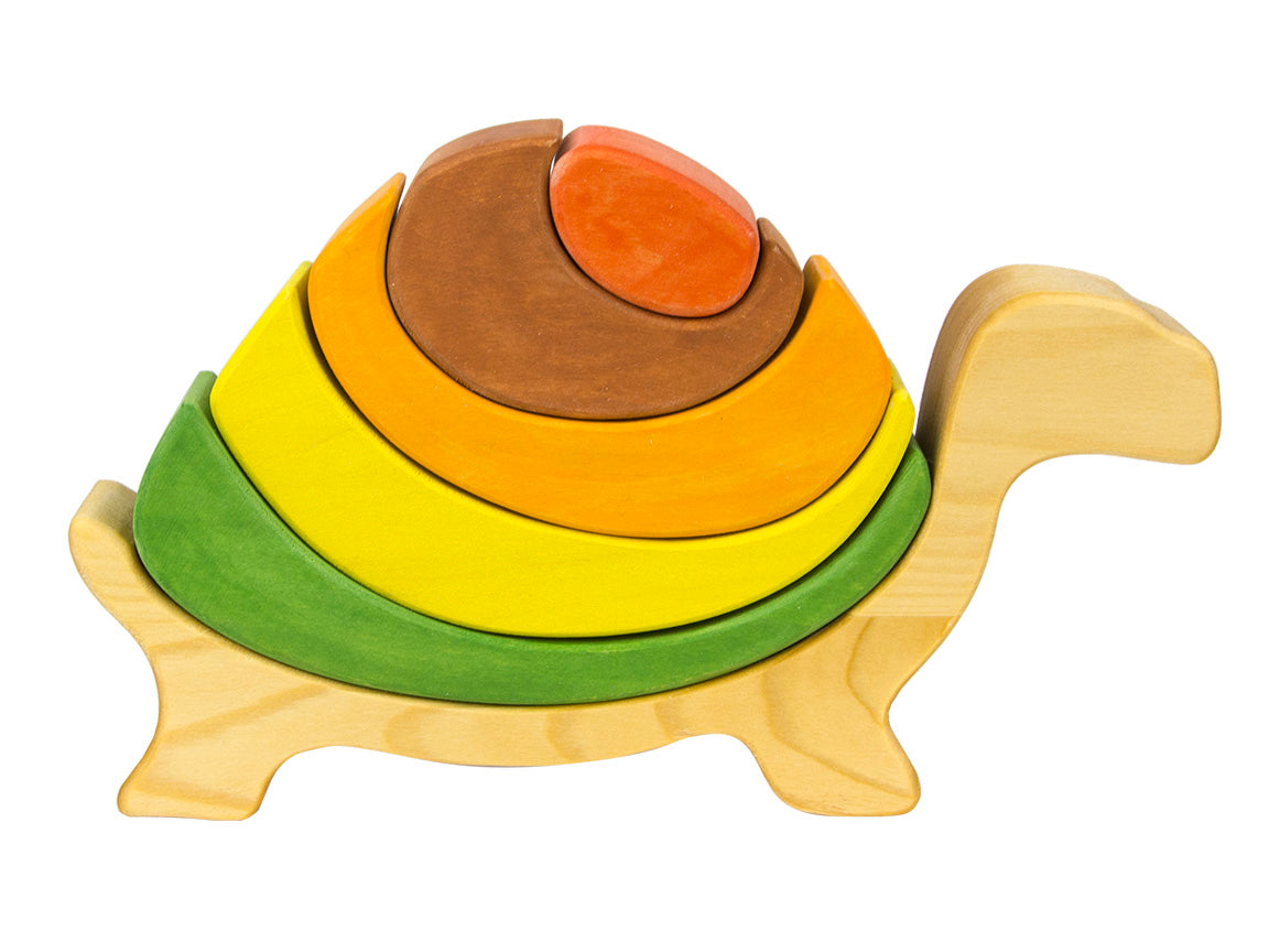 Wooden turtle-shaped puzzle with colorful rings on a white background