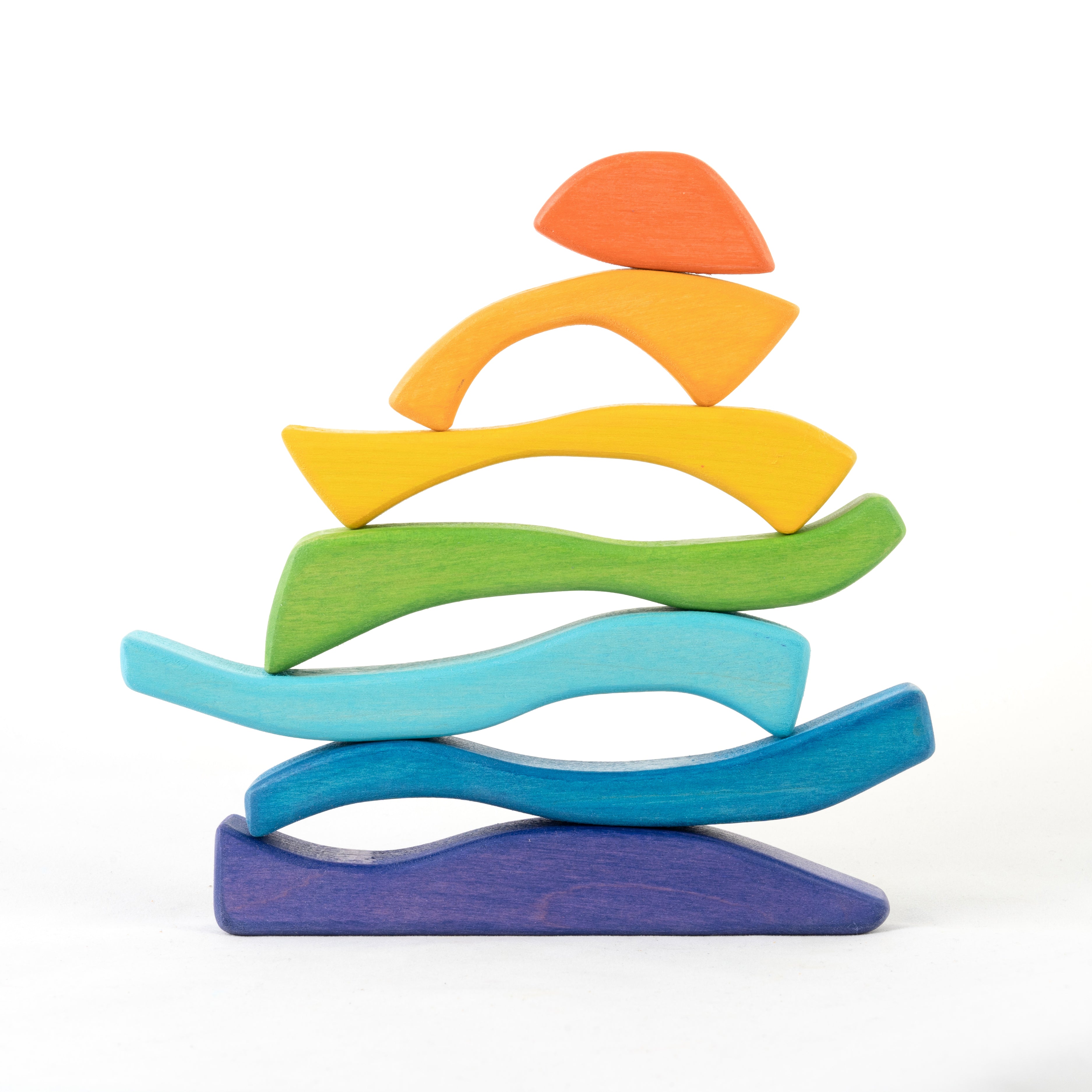 Colorful wooden toy with wavy design on a white background