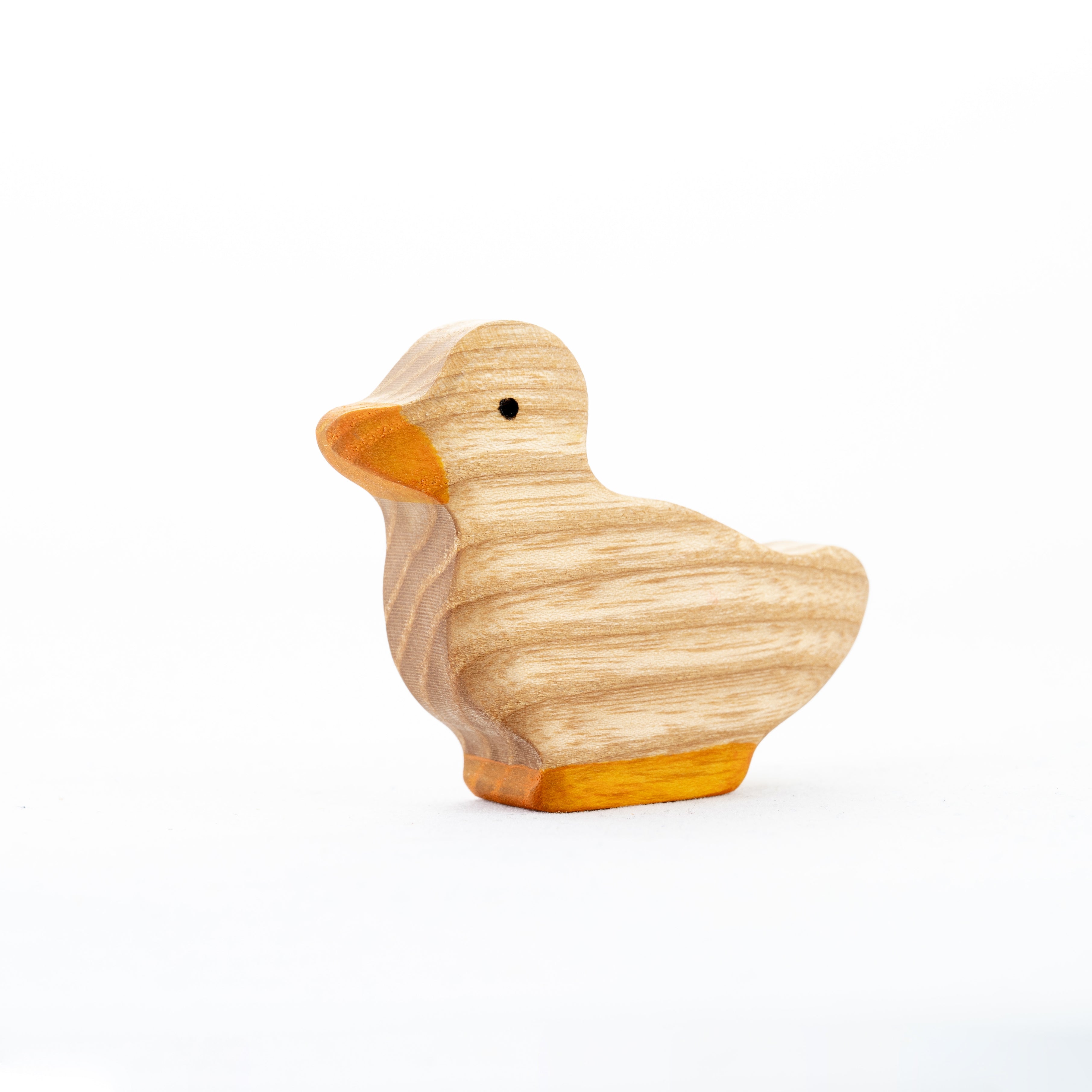 Wooden duck figurine on a white background