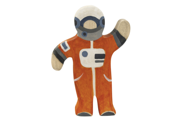 Toy figure of an astronaut in an orange suit on a white background