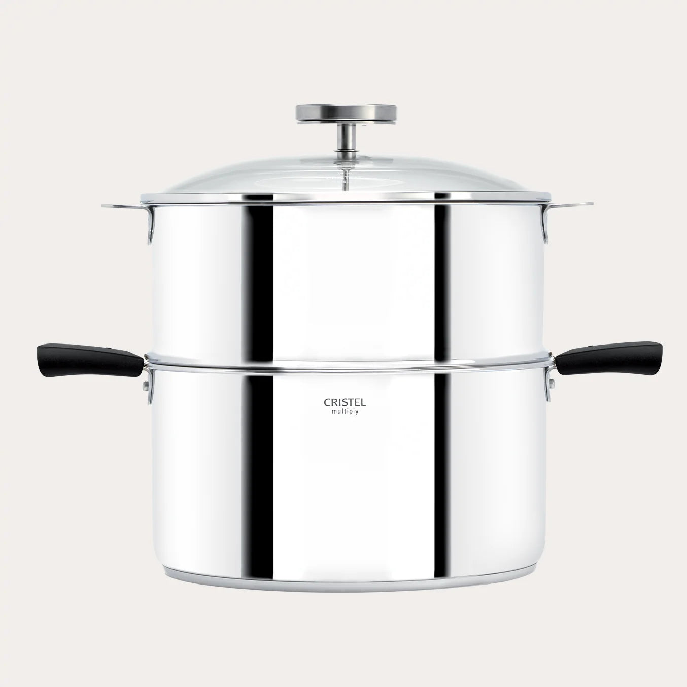 Stainless steel pot with lid and black handles on a light beige background
