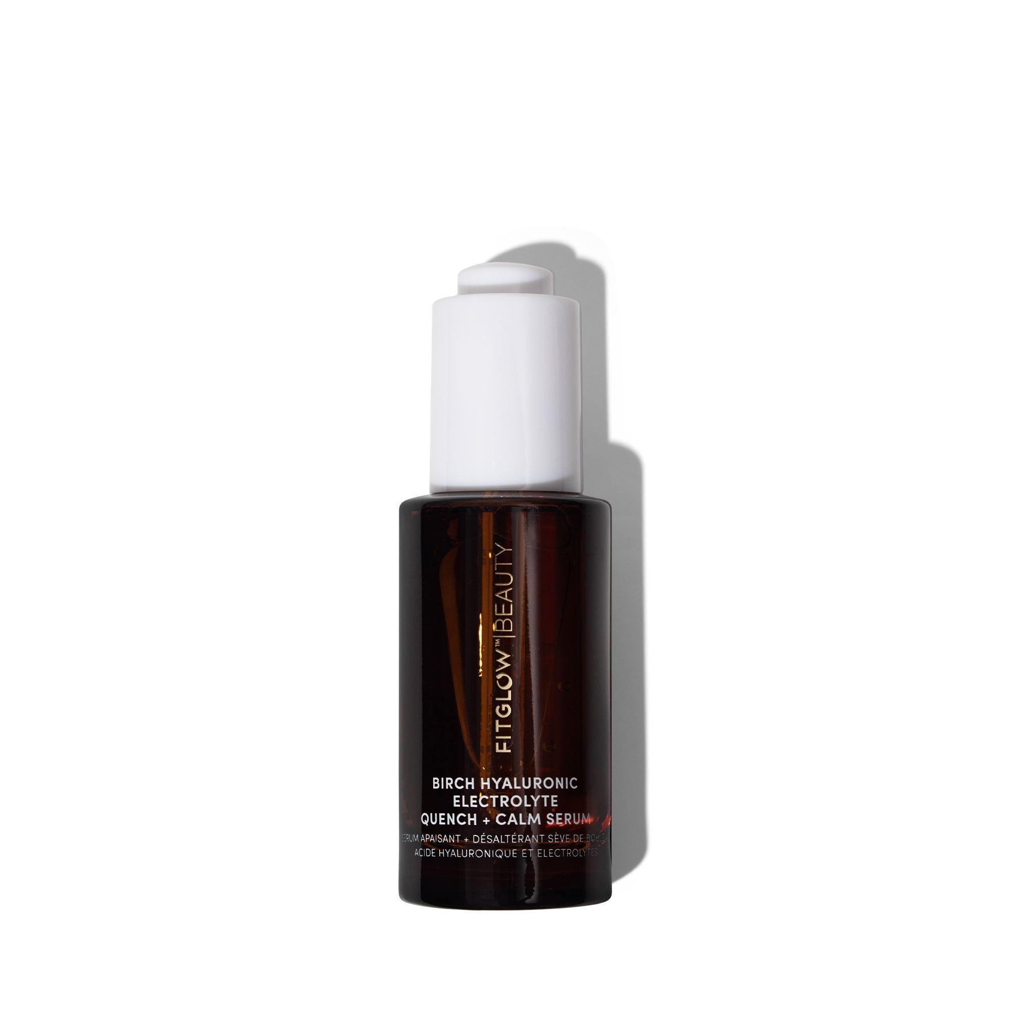 Fitglow beauty serum bottle on a white background