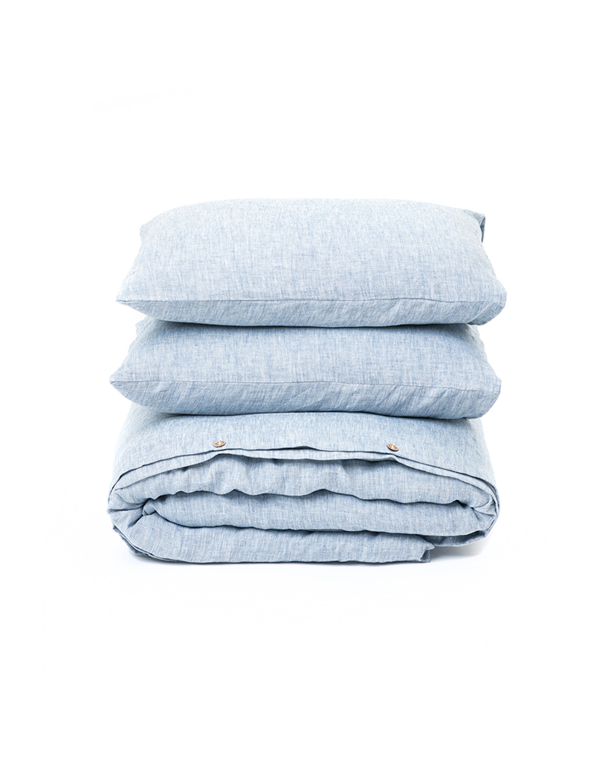 Stack of light blue folded fabrics on a white background