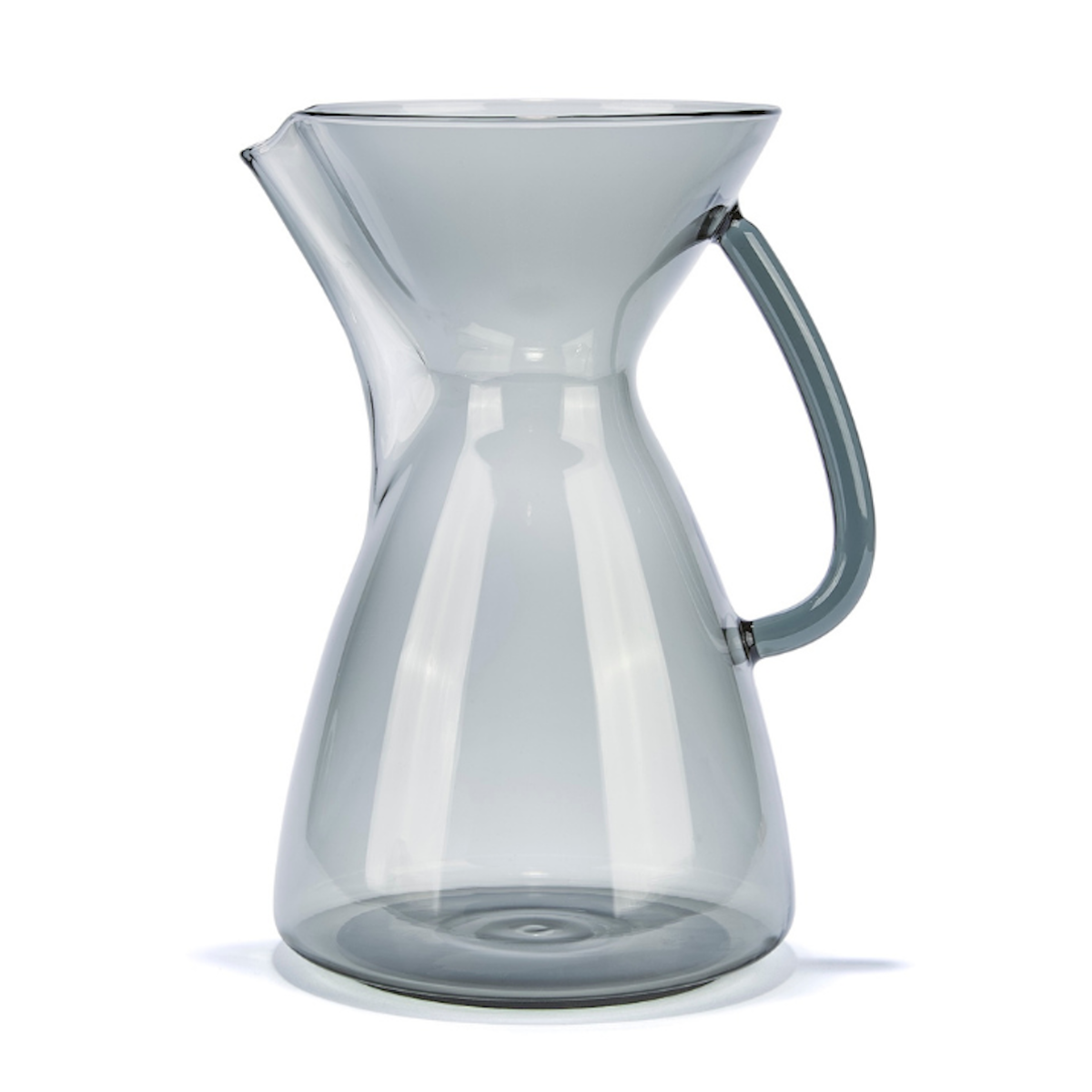 Clear glass pitcher with handle on a white background