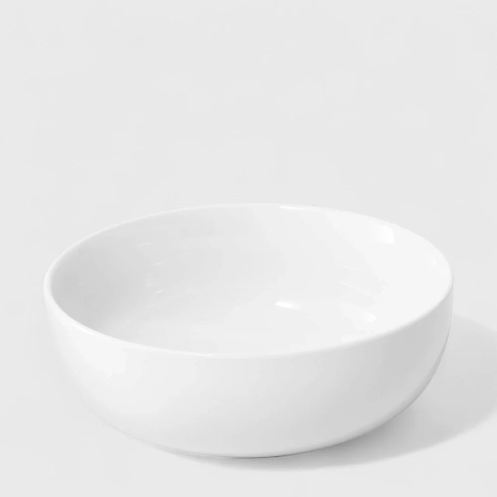 White ceramic bowl on a light gray background