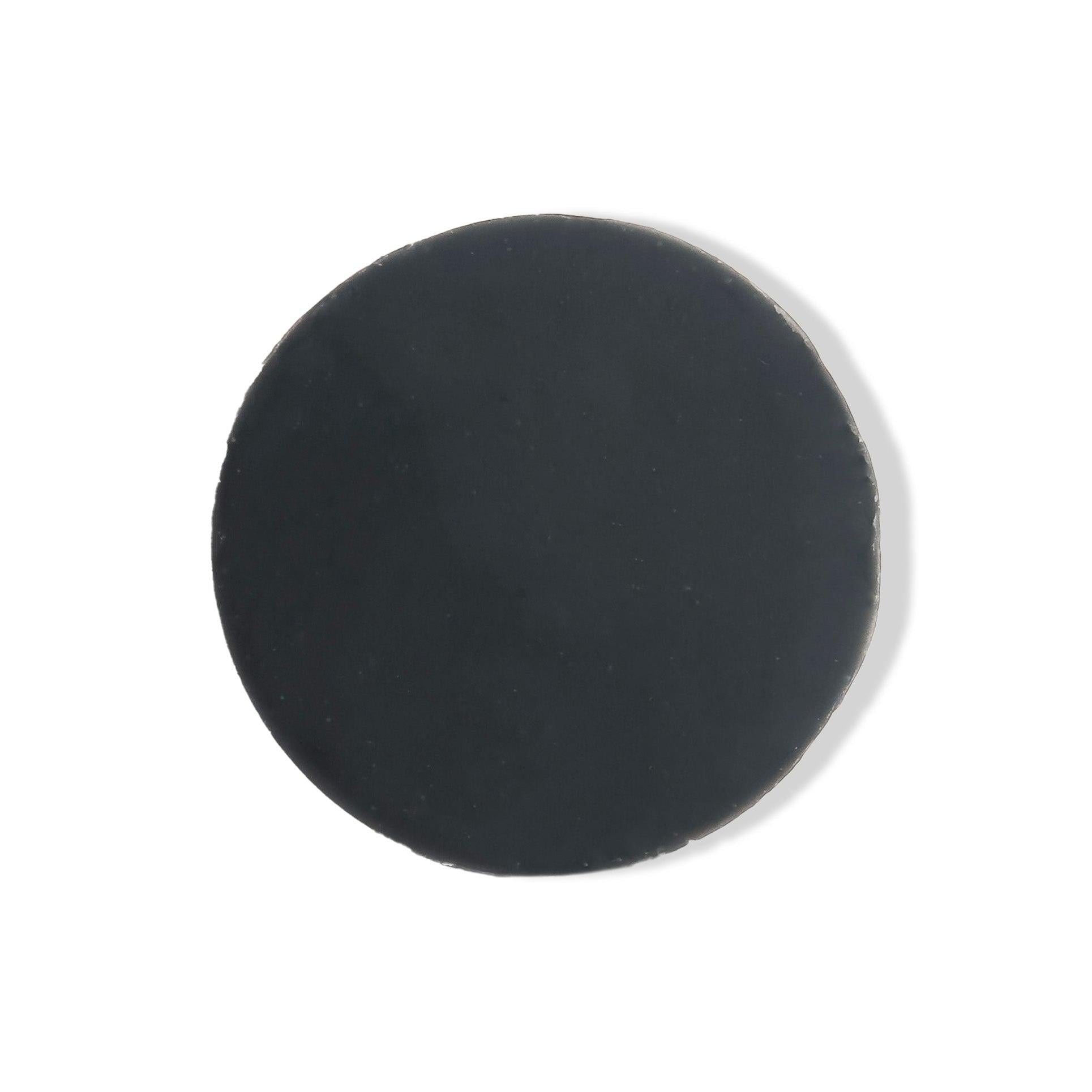 Black round object on a white background