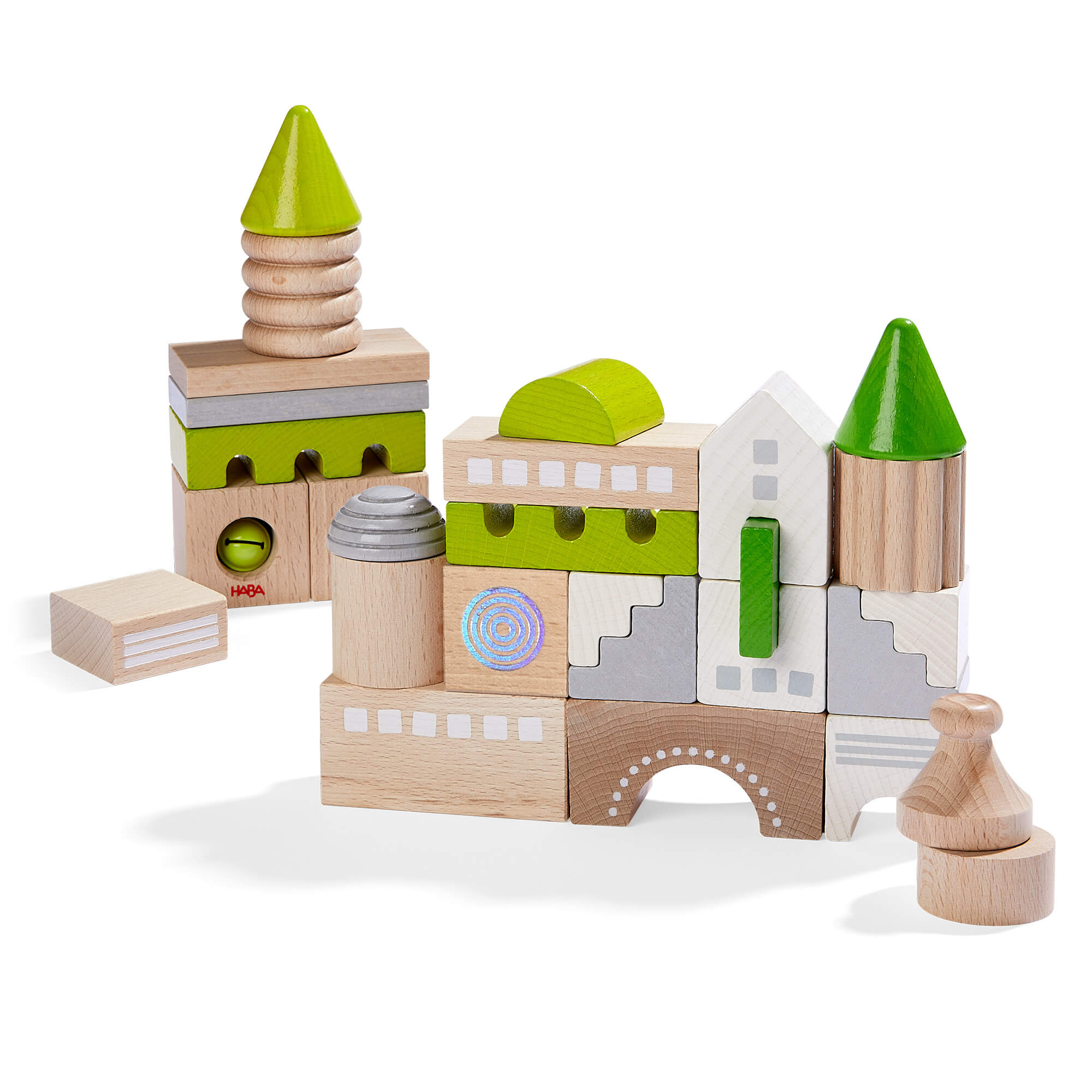 Wooden toy blocks with green and gray accents on a white background